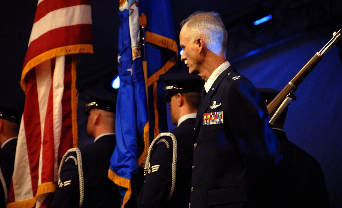 Col. Robert S. Arthur, 442nd Fighter Wing commander, stands at attention while the Whiteman Air Force Base Honor Guard marches off-stage in front of the Kansas City Symphony during a  Memorial Day observance, May 25, 2008.  Colonel Arthur was the military master of ceremonies for the annual "Celebration at the Station" observance produced by the Kansas City Symphony at Union Station and the World War I Liberty Memorial in downtown Kansas City.  The evening's events included patriotic music performed by the symphony, as well as ceremonies honoring all members of the U.S. armed forces in front of more than 40,000 spectators.  The 442nd Fighter Wing is an Air Force Reserve A-10 Thunderbolt II-unit based at Whiteman Air Force Base, Mo. (U.S. Air Force photo/Maj. David Kurle)