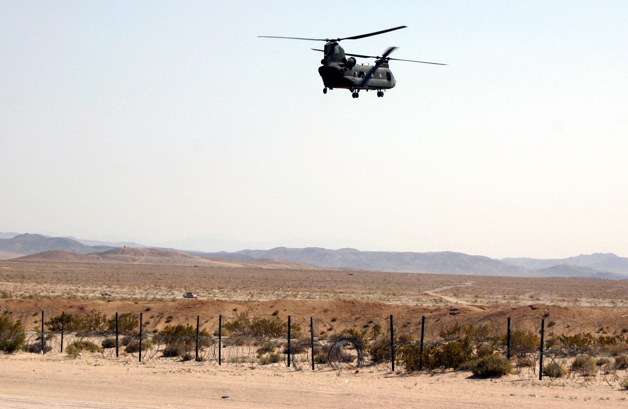 An Army CH-47 Chinook helicopter prepares to land as part of the training that integrated a variety of joint assets during NTC rotation 08-06 at Ft. Irwin, Calif.  (Photo by  Casey Bain)