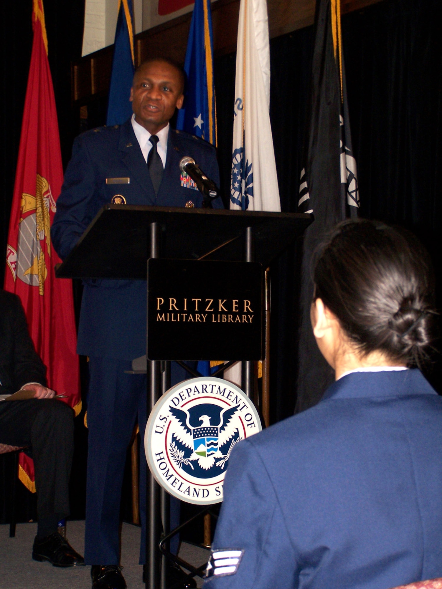 Brig. Gen. Darren McDew, director of public affairs, Office of the Secretary of the Air Force, was the keynote speaker for the U.S. Citizenship and Immigration Services Naturalization ceremony at the Pritzker Military Library in Chicago.  The only Air Force member among the 30 new citizens was Senior Airman Katherine Collantes. She was assigned to the 434th Air Refueling Wing, Grissom Air Reserve Base, Ind. (U.S. Air Force photo)