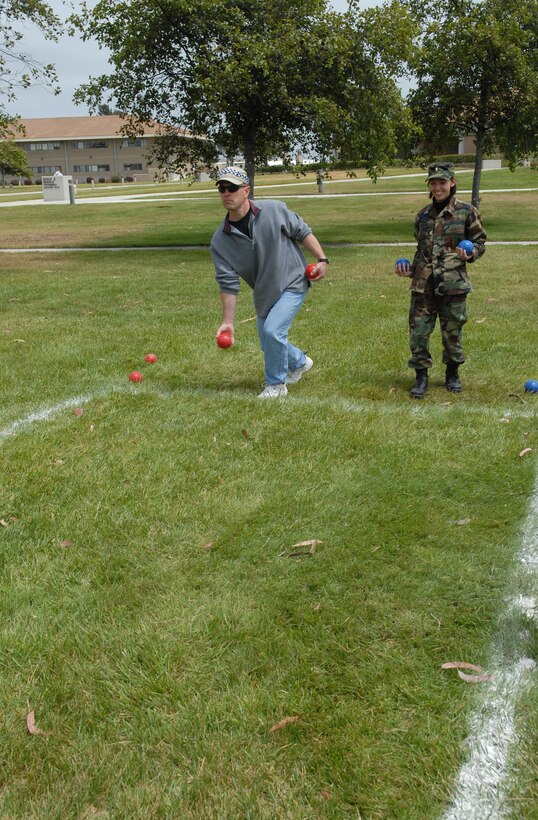 VANDENBERG AIR FORCE BASE, Calif., -- Capt. Richard Maze throws his bocce ball during a combat bocce ball tournament at the 392nd training squadron.The combat bocce ball tournament is a low-impact, high smack-talk morale booster. Having events that raise morale is vitally important to keep up the efficiency and productivity of todays combat Airman. (U.S. Air Force photo/Airman 1st Class Nathaniel Prost)