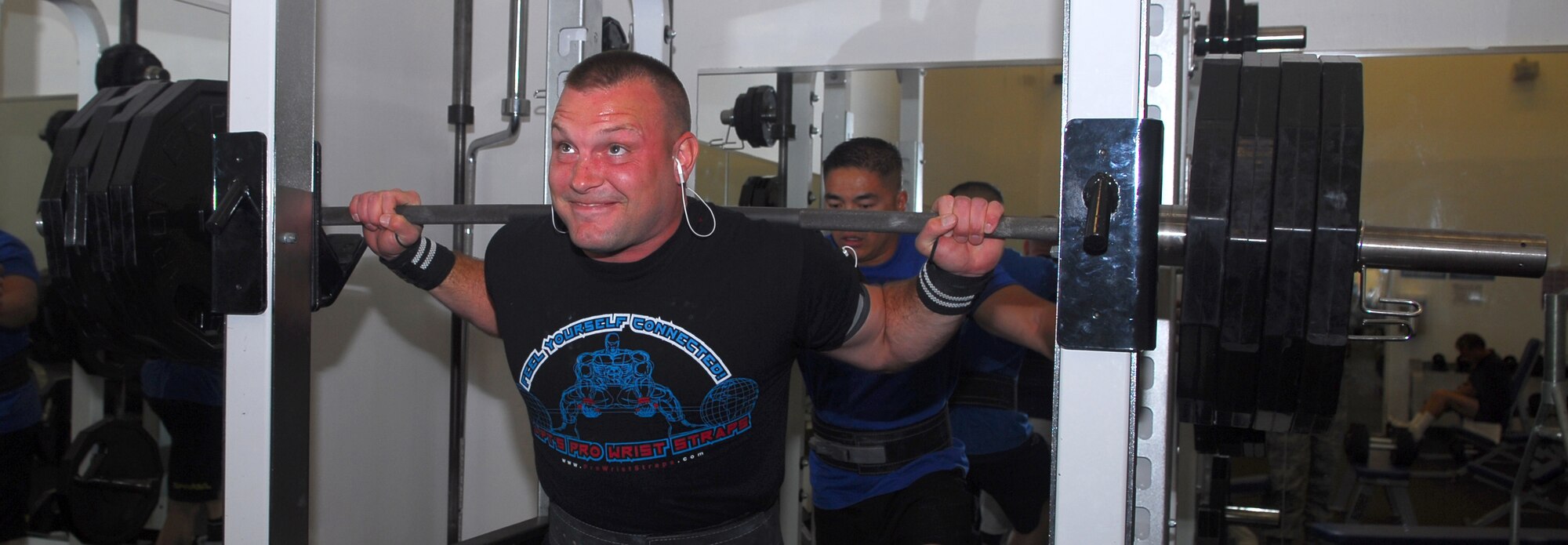 Staff Sgt. Sean Yargus does squats as Tech. Sgt. Rudy Garcia spots hime while they train at the base fitness center.  Both Airman are in the 30th Security Forces Squadron and won their weight class at the United States Powerlifting Federation Military National Powerlifting Competition May 3 in San Diego.  Senior Master Sgt. Fred Sheffield, also with the 30th SFS, also participated and won in his division.  Sergeant Yargus lifted in the 182-198lbs Open Men's Division.  He took 1st place with a bench of 325lbs--a personal best in competition. (U.S. Air Force photo/Staff Sgt. Jamie Lessard)
