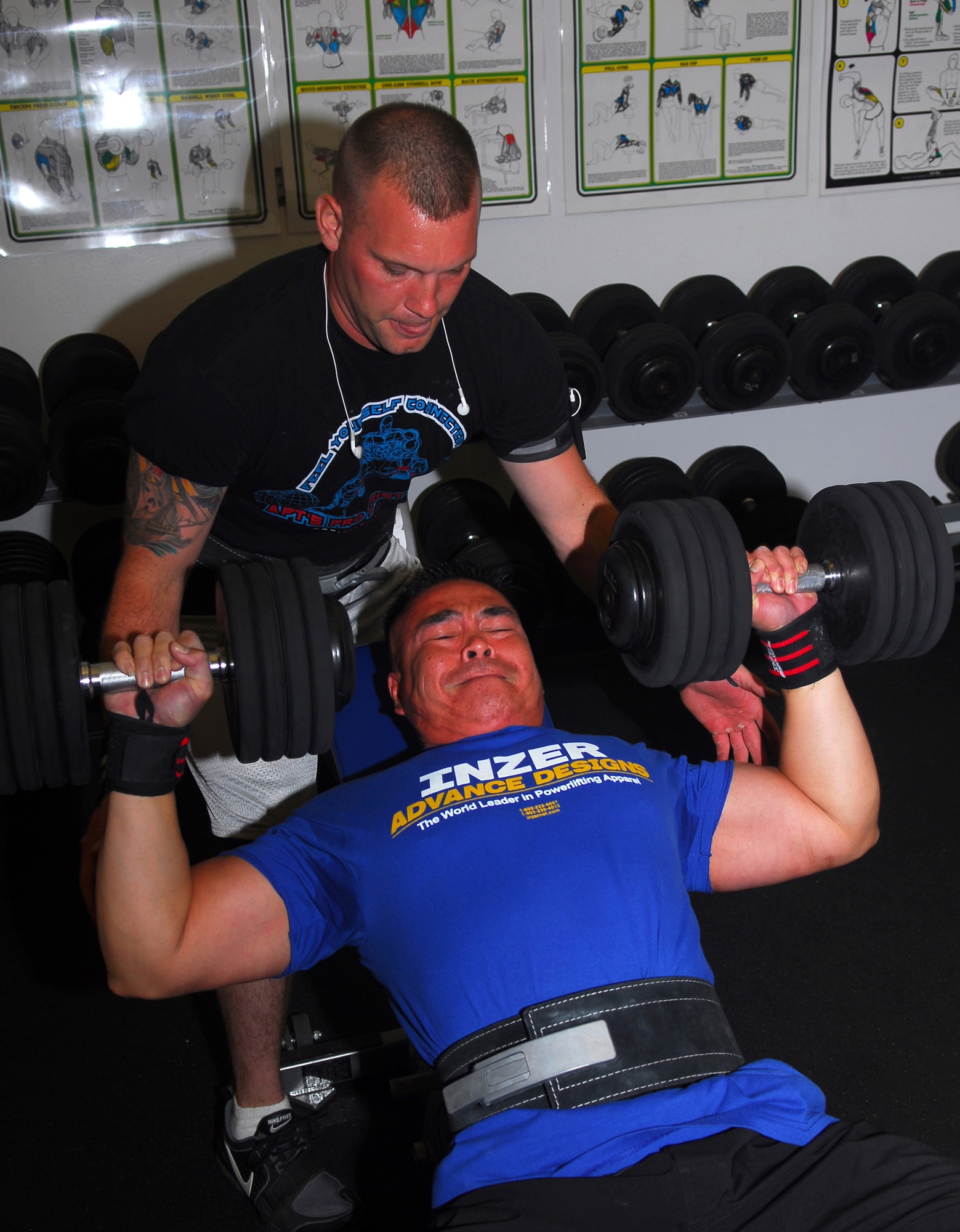 Staff Sgt. Sean Yargus spots Tech. Sgt. Rudy Garcia while they train at the base fitness center.  Both Airman are in the 30th Security Forces Squadron and won their weight class at the United States Powerlifting Federation Military National Powerlifting Competition May 3 in San Diego.   Senior Master Sgt. Fred Sheffield, also with the 30th SFS, also participated and won in his division.  Sergeant Garcia lifted in the 149-165lbs Open Men's Division.  He took 1st place with a bench of 336lbs--more than double his body weight! (U.S. Air Force photo/Staff Sgt. Jamie Lessard)