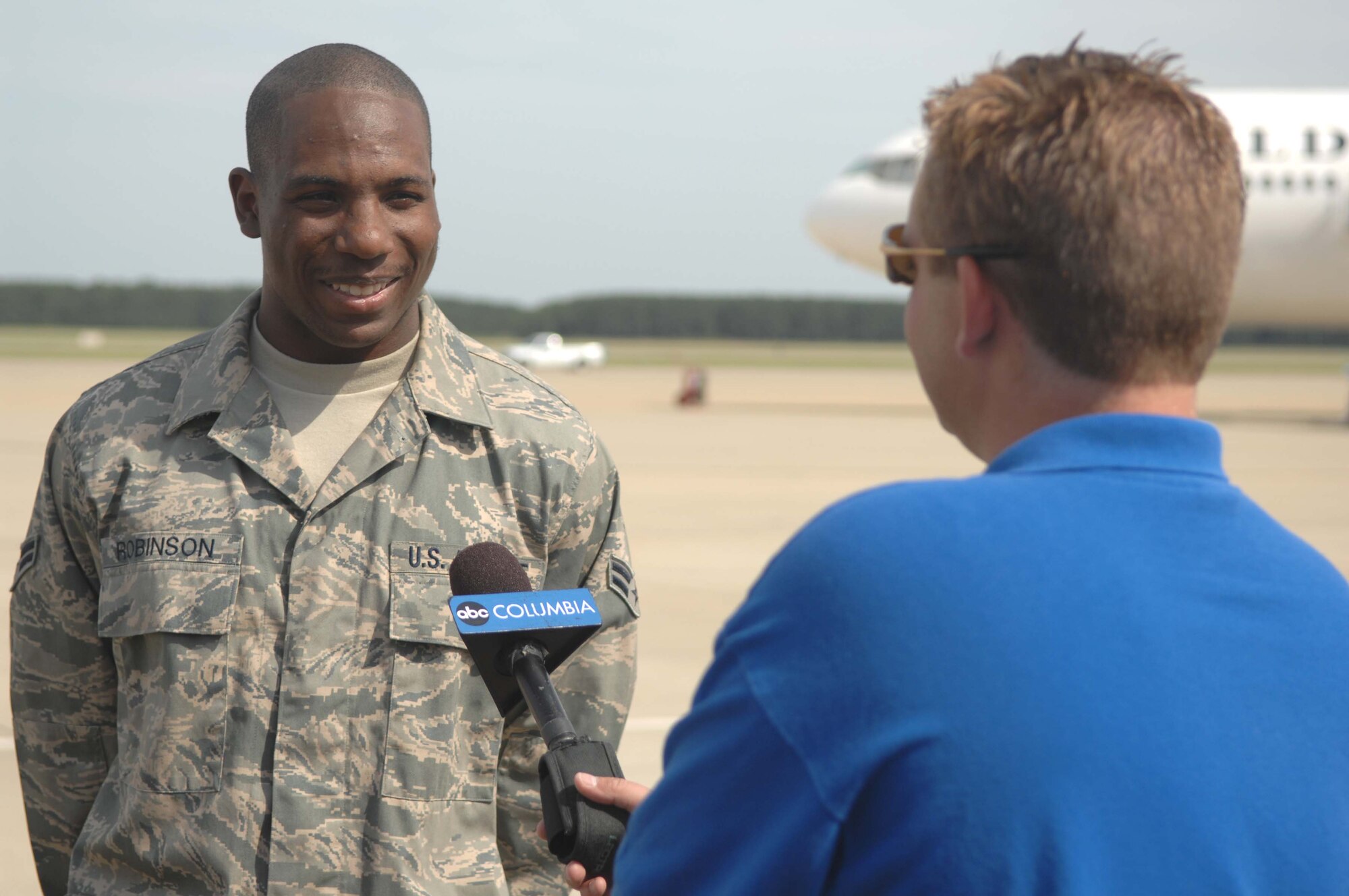 SHAW AIR FORCE BASE, S.C. -- Airman 1st Class Teko Robinson, 20th Aircraft Maintenance Squadron crew chief, talks with a reporter from ABC Columbia News about his feelings towards his first deployment. More than 200 Airmen and a dozen F-16s from 77th Fighter Squadron deployed to Southwest Asia over the Memorial Day weekend to support the Global War on Terrorism. (U.S. Air Force photo/Airman 1st Class Matthew Davis)