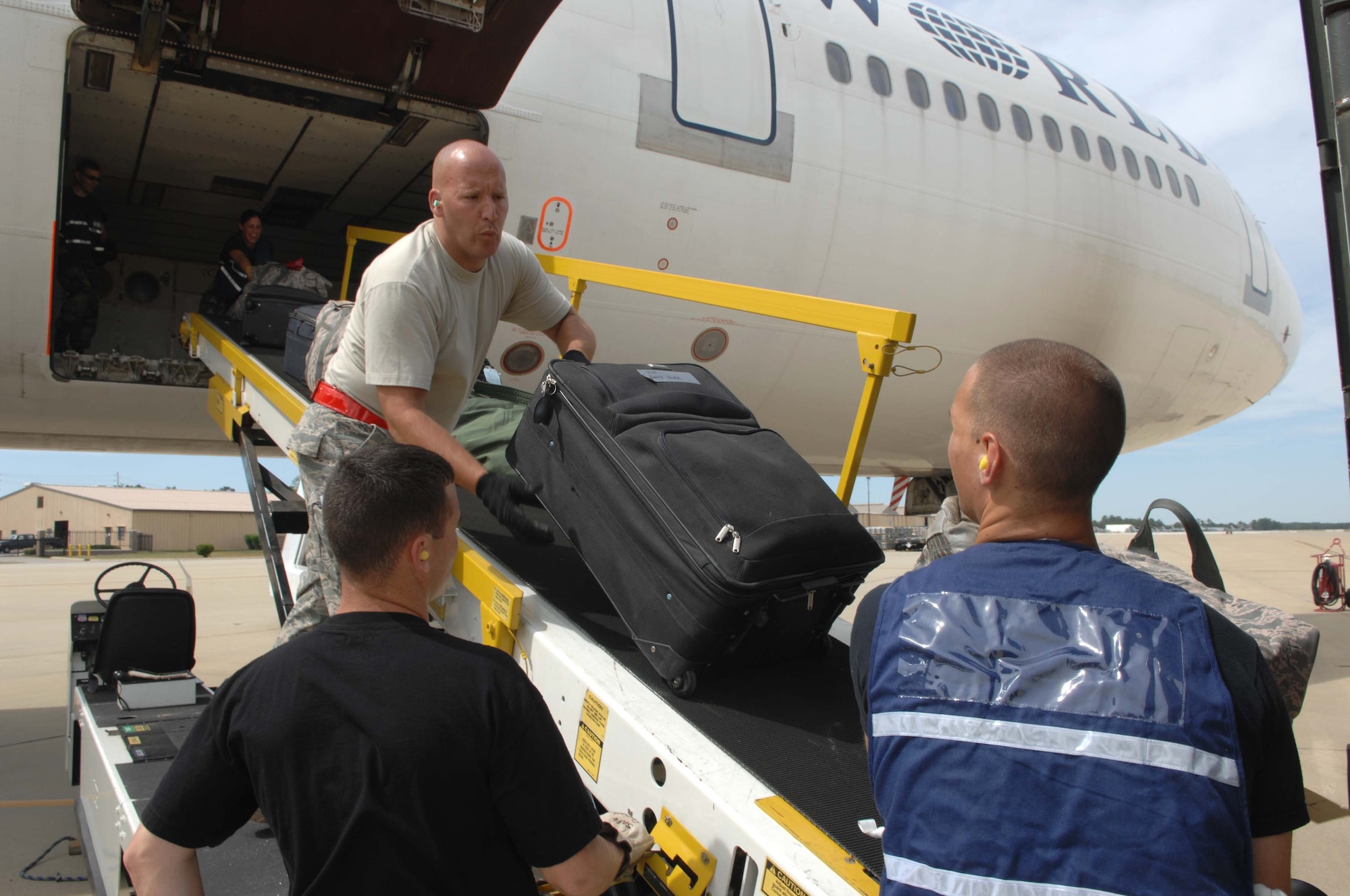SHAW AIR FORCE BASE, S.C. -- Tech. Sgt. Joe Allen, 20th Logistics Readiness Squadron deployment coordinator, loads cargo for Airmen set to deploy on May 22. More than 200 Airmen and a dozen F-16s from the 20th Fighter Wing deployed to Southwest Asia to support the Global War on Terrorism. (U.S. Air Force photo/Airman 1st Class Matthew Davis)