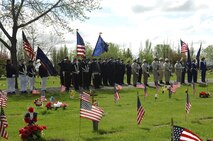 MINOT AIR FORCE BASE, N.D. -- A special formation of Minot Air Force Base, Veterans of Foreign Wars Post 753, American Legion and Ladies Auxiliary VFW Post 573 present the colors during Minot's Memorial Day ceremony May 26 at Rosehill Memorial Cemetery. (U.S. Air Force photo by Airman 1st Class Wesley Wright)