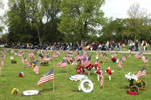 MINOT AIR FORCE BASE, N.D. -- Onlookers pay respect to veterans during Minot's Memorial Day ceremony May 26 at Rosehill Memorial Cemetery. (U.S. Air Force photo by Airman 1st Class Wesley Wright)