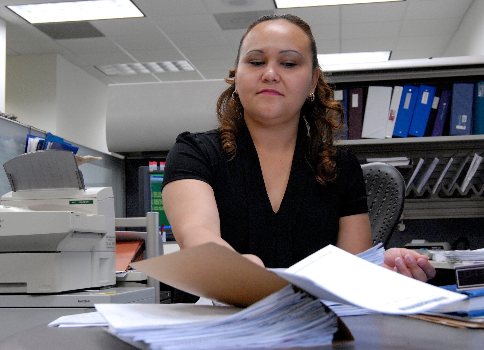 Leris McCaffrey, 95th Force Support Squadron accounting technician, is the Team Edwards Specialist Civilian of the Quarter. Among her accomplishments during the quarter, Ms. McCaffrey transformed a 25-year-old program to the new Web-based Nonappropriated Funds Inventory System and trained managers and 12 operation clerks on accounting procedures and guides. She is currently working toward her associate's degree in business management. (Air Force photo by Senior Airman Stacy Sanchez)