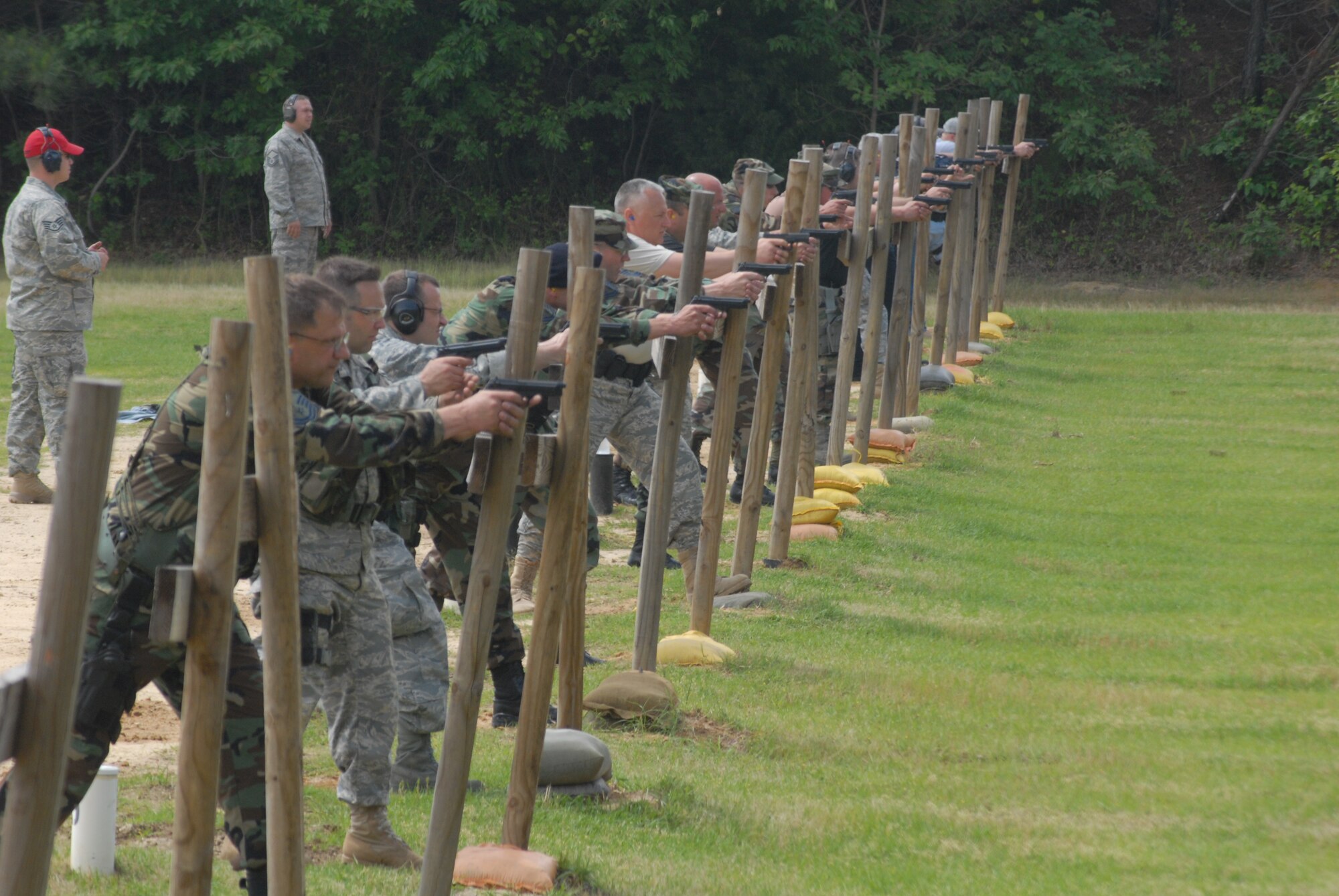 Nineteen participants from law enforcement agencies from around the Fayetteville region take aim at the pistol portion of the small arms competition during the National Law Enforcement Week conclusion at Pope May 16. (U.S. Air Force Photo by Staff Sgt. Jon LaDue