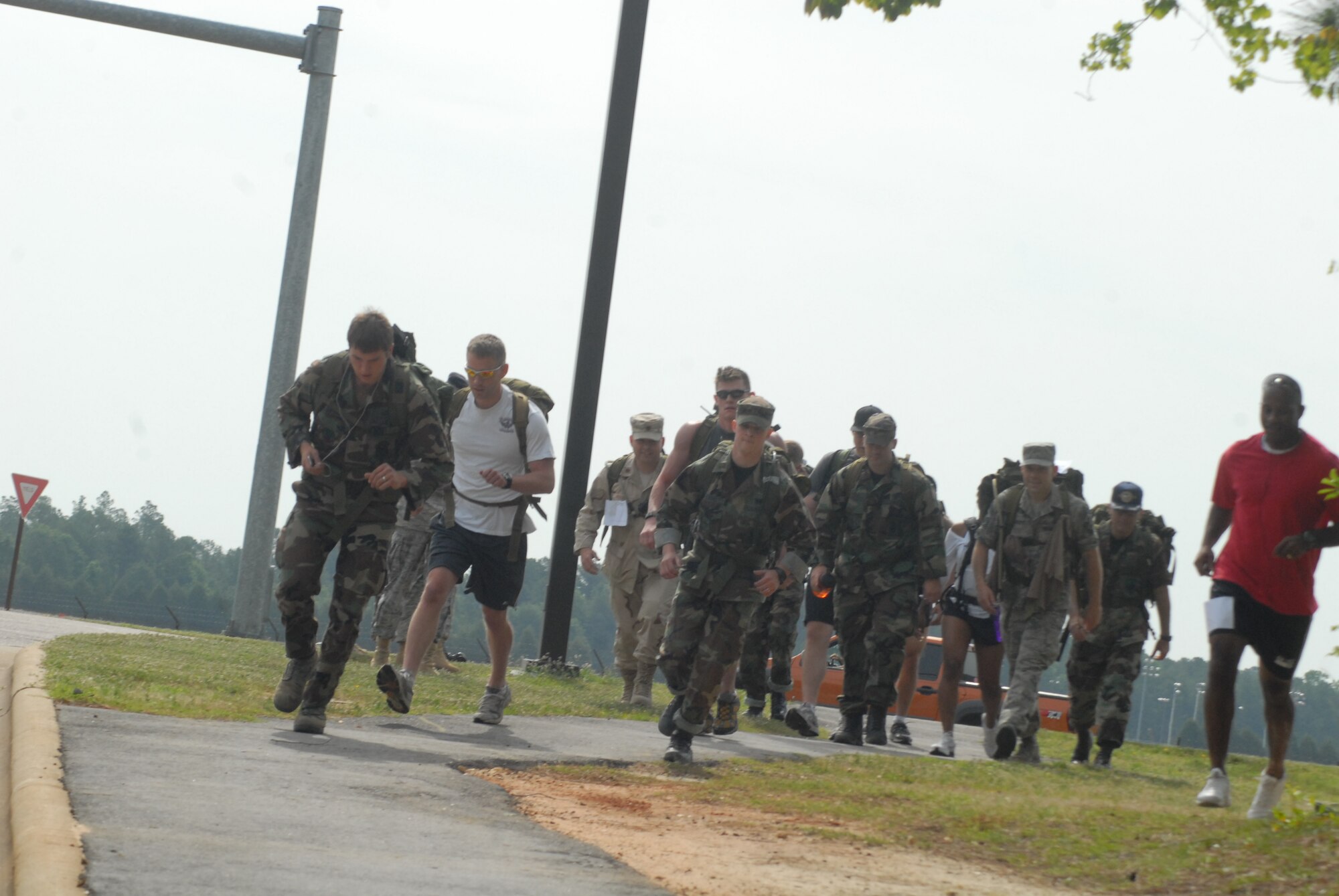 Airmen begin a 6.5 mile trek around the flightline for the ruck/run competition that took place May 14 as part of Pope's National Police Week celebration. Prizes were awarded to the top ruck/runner in three categories. Master Sgt. Anthony Frazier, 43rd Security Forces Squadron won the run category, Senior Airman Chris Bederio, 43rd Maintenance Squadron won the light ruck category and Senior Airman Adam Crown, 43rd Operations Squadron, won the heavy ruck category. (U.S. Air Force Photo by Staff Sgt. Jon LaDue