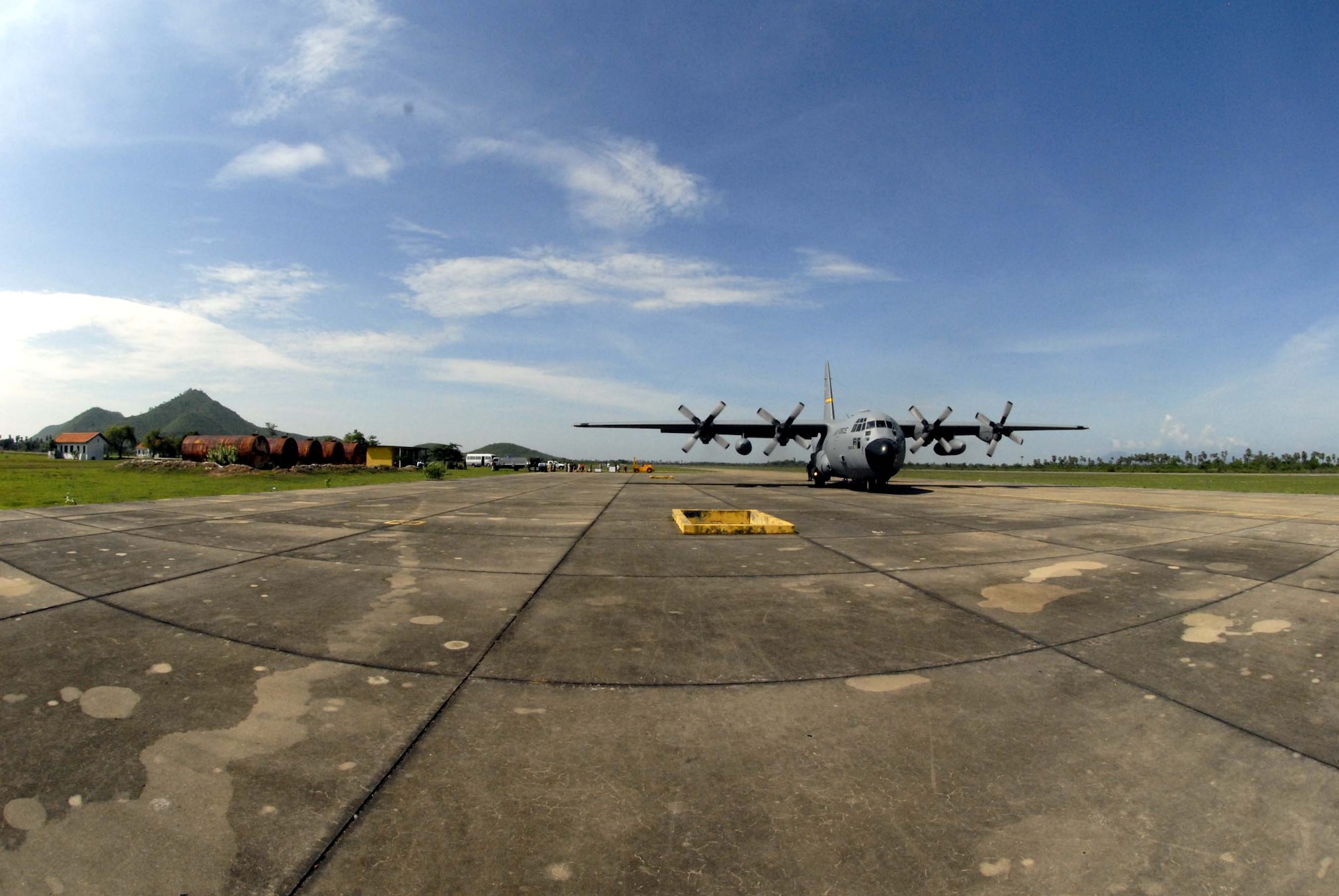 KAMPONG CHHNANG PROVINCE, Cambodia -- A C-130 from 144th Airlift Squadron, 176th Wing Kulis Air National Guard Base, Anchorage Alaska taxis down the runway after landing at Kampong Chhnang Province airfield Cambodia May 24. The ANG C-130 was the first ever U.S. military aircraft to land at this countryside airfield since it was built in 1975 under the Pol Pot’s regime.  This mission delivered 3000 pounds of medical supplies for two separate operating locations in Cambodia in support of Operation Pacific Angel, a joint/combined humanitarian assistance operation conducted in the Pacific area of responsibility in support of CDRUSPACOM capacity-building efforts.  Participating services include the Active, Reserve and National Guard components of the U.S. Air Force, U.S. Army, Royal Thai Air Force (RTAF), and Royal Cambodian Armed Forces (RCAF). U.S. Air Force photo/Tech. Sgt. Tom Czerwinski.