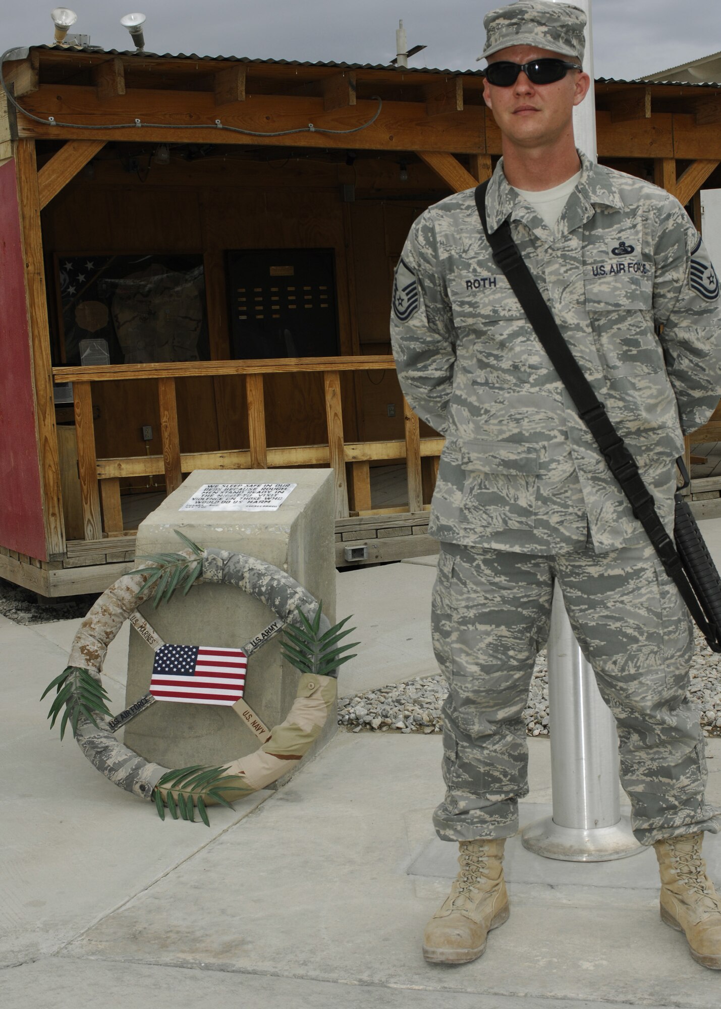 BAGRAM AIR FIELD, Afghanistan – Master Sgt. James Roth, 455th Expeditionary Force Support Squadron, stands watch during the 11-hour silent vigil here May 26. More than 130 Airmen and one civilian guarded the wreath laid at the camp’s flag pole from 7:30 a.m. to 6:30 p.m., in honor of those who gave the ultimate sacrifice. (U.S. Air Force photo by Capt. Toni Tones)