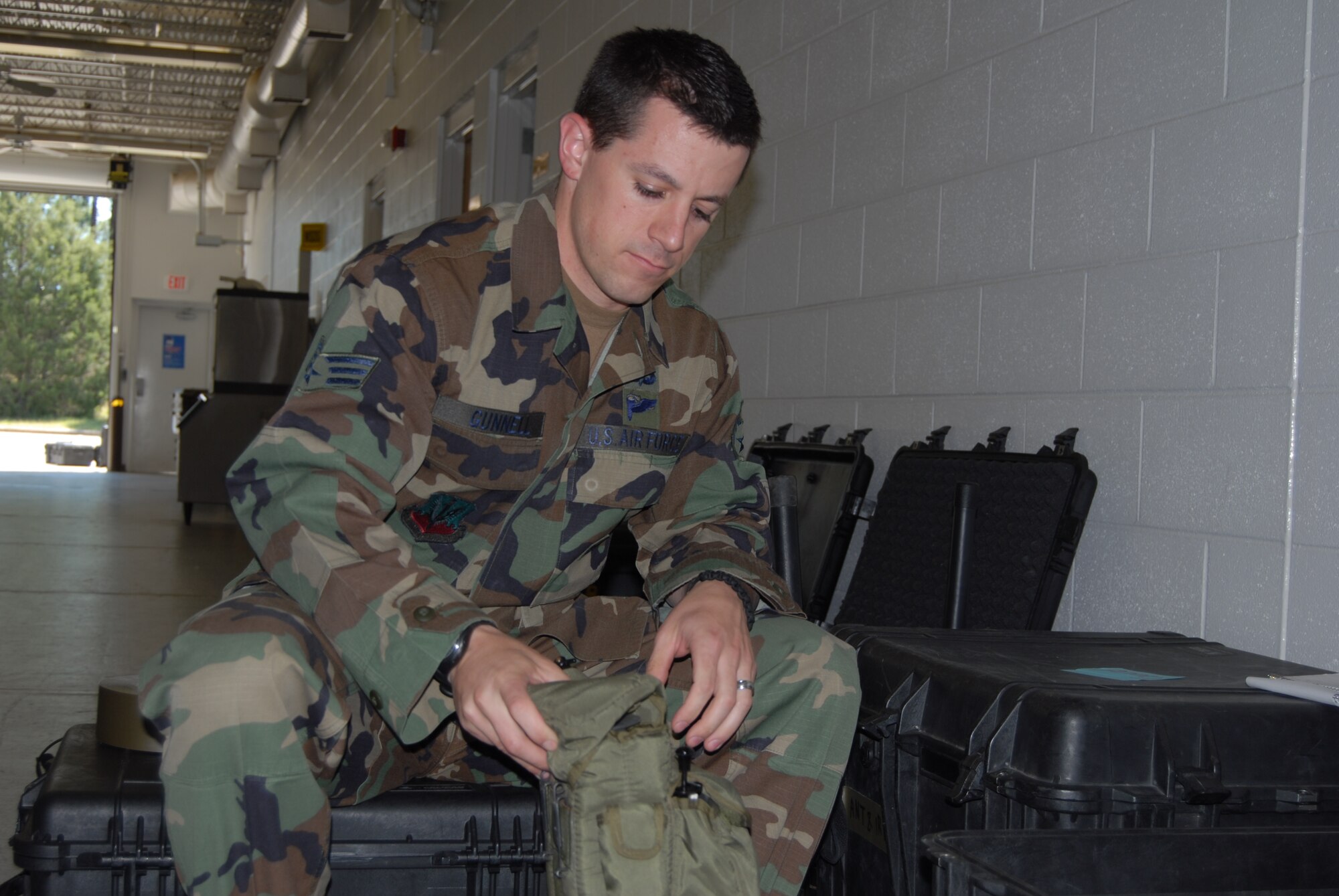 Senior Airman Thomas Gunnell, 14th Air Support Operations Squadron, checks joint terminal attack controller equipment. (U.S. Air Force Photo by Airman 1st Class Mindy Bloem)