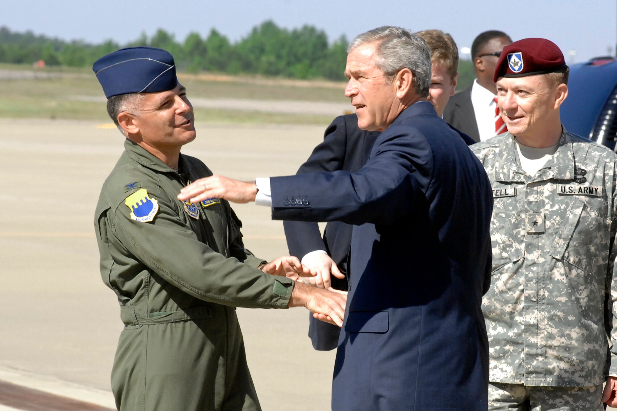 Col. John McDonald, 43rd Airlift Wing Commander, shakes hands with President George W. Bush May 22nd on Pope's Green Ramp. Air Force One landed and departed from Pope as President Bush visited neighboring Fort Bragg for the finale of All-American Week, which included 17,000 Soldiers marching in the 82nd Airborne Division review parade. (U.S. Air Force Photo by Mike Murchison)