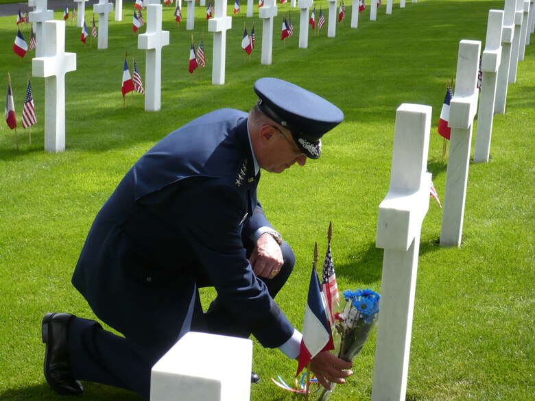 General Roger Brady, Commander, United States Air Forces in Europe, lays flowers at a grave of a World War I veteran at the Suresnes American Cemetery outside of Paris.  From aircraft flyovers to band performances, USAFE supported more than 20 events in Europe over the Memorial Day weekend.  (Photo by Susan Strednansky)
