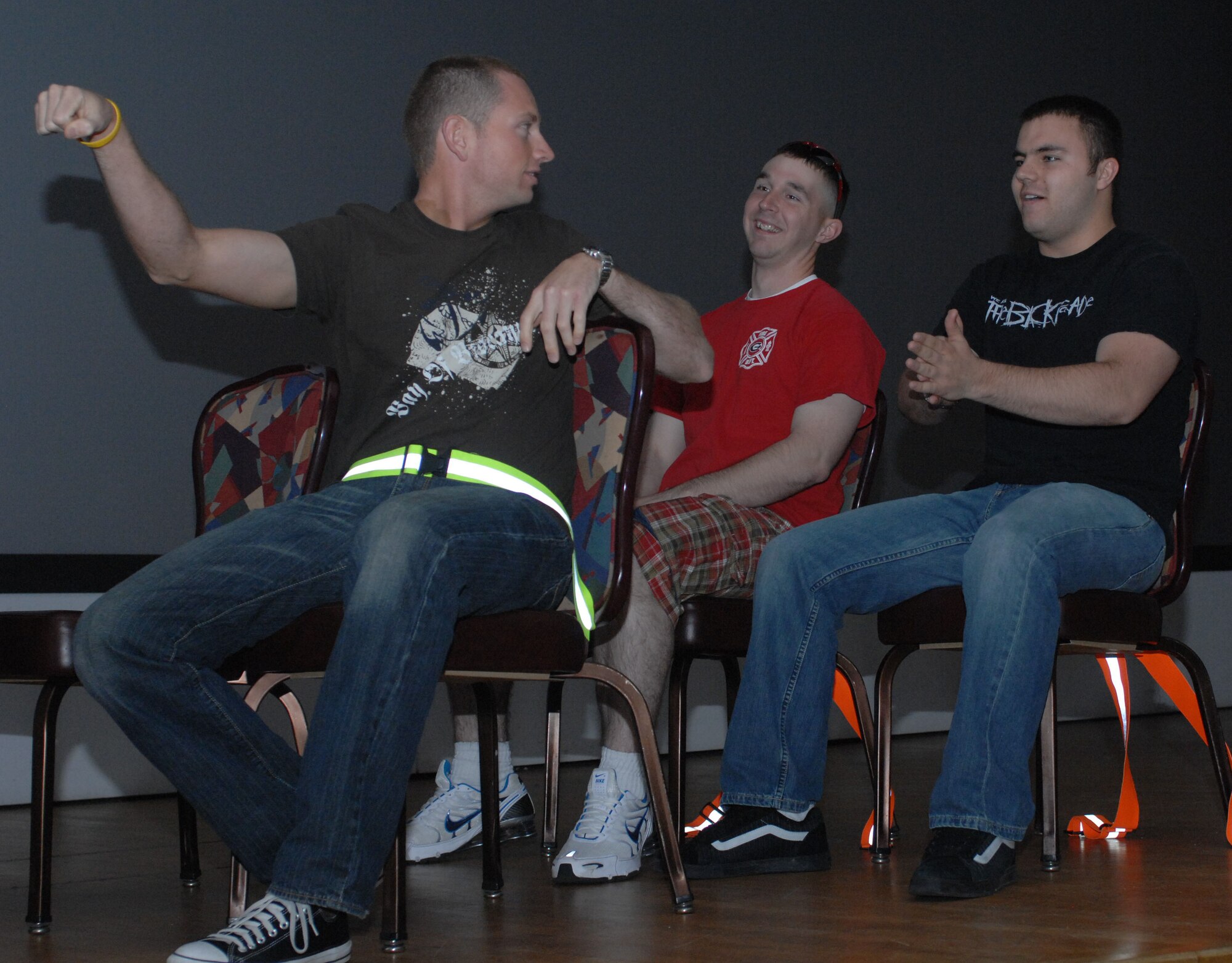 Staff Sergeant Joshua Rapp (front), Senior Airman Cole Mongomery (back right), and Team Mildenhall's own Airman first Class Davis Yawn  (back left) from 100th Sucurity Forces Squardron, act out a skit for the USAFE saftey road show May 14, 2008 at RAF Mildenhall. The skit was designed to explain the importance of having a designated driver for a night on the town. The road show was hosted by Col. Robert G. Wright , Jr director of USAFE Safety. (U.S Air Force Photo By Airman First Class Brad Smith)    