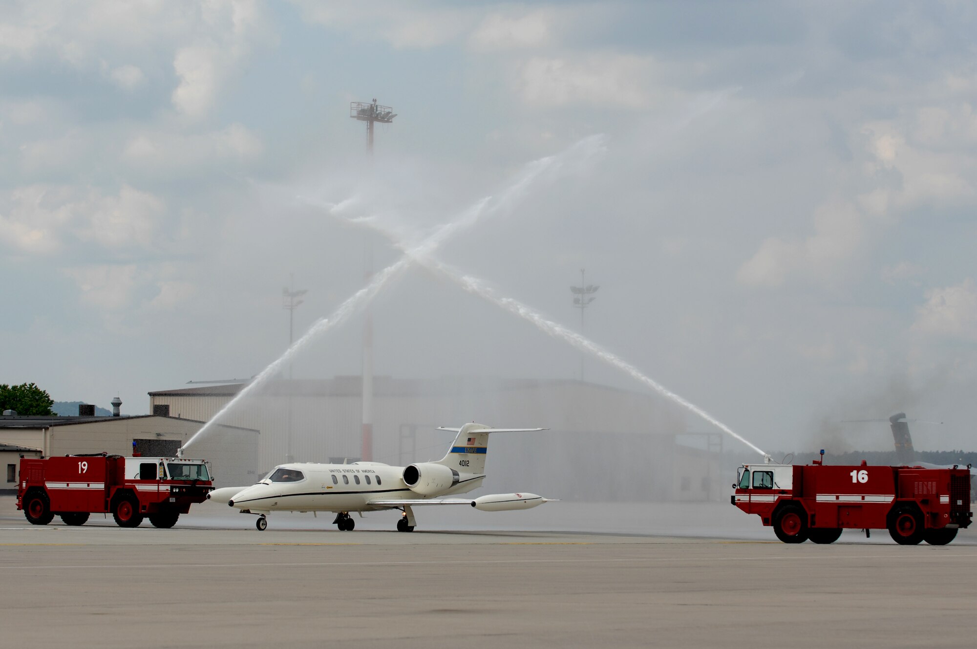 Lt. Gen. Robert D. "Rod" Bishop Jr., 3rd Air Force commander, taxis through an arch of water during his final flight, May 23, 2008. For his final flight Lt. Gen. Bishop flew a C-21. (U.S. Air Force photo by U.S. Airman 1st Class Nathan Lipscomb) (RELEASED*)