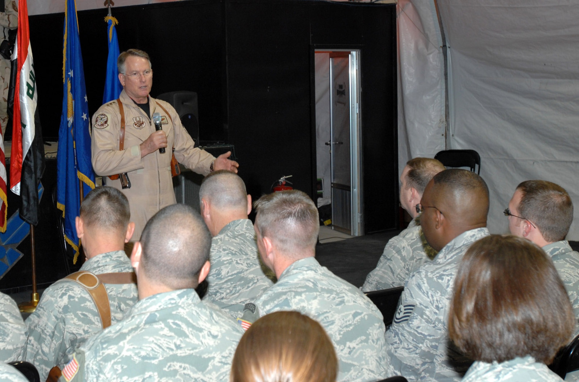 Lt . Gen. John Bradley, commander of Air Force Reserve Command (right), addresses Airmen from the 506th Air Expeditionary Group during a commander's call May 25 here. General Bradley is visiting Airmen throughout the deployed environment to thank them for their service supporting the Global War on Terrorism. (U.S. Air Force photo by Senior Master Sgt. Don Senger)