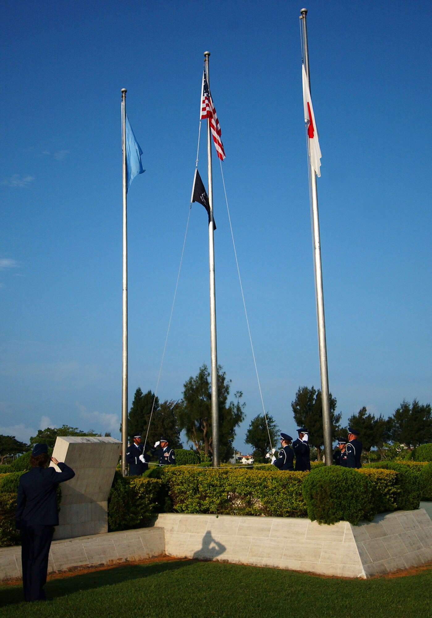 The Kadena Air Base Honor Guards raises the flags for the National Anthem during a Memorial Day ceremony at Kadena Air Base, Japan, May 26. Veterans and military members from all four branches of the military attended the event to remember those who died in our nation's service.
(U.S. Air Force photo/Tech. Sgt. Rey Ramon)