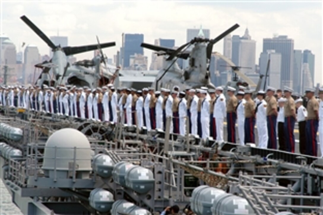 U.S. sailors and Marines man the rails of the amphibious assault ship USS Kearsarge during the parade of ships on the opening day of Fleet Week in New York, May 21, 2008. More than 4,000 sailors, Marines, and Coast Guardsmen were expected to participate in community relations projects.