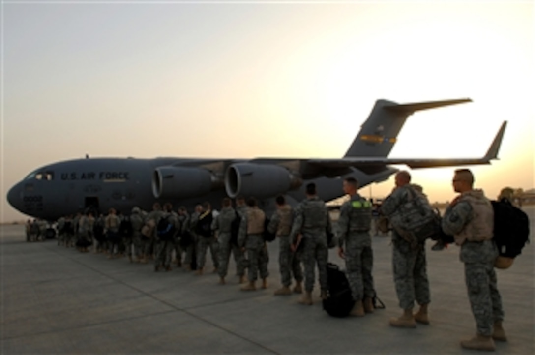 U.S. airmen assigned to the 332nd Air Expeditionary Wing board a C-17 Globemaster III aircraft at Balad Air Base, Iraq, on May 21, 2008.  The airmen are re-deploying to their home stations following successful four and six-month tours in Iraq.  