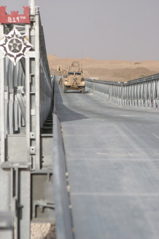 BAGHDADI, Iraq (May 27, 2008) â?? A Mine-Resistant Ambush-Protected vehicle crosses the newly finished Baghdadi Bridge. Marines, Soldiers, Sailors and Iraqis worked together to complete the 301-meter bridge May 22, making it the longest floating bridge in Iraq, said Capt. Douglas R. Cunningham, company commander for Maintenance Company, Combat Logistics Battalion 6, 1st Marine Logistics Group.::r::::n::This bridge will serve as a new way to reach the other side of the Euphrates River. Previously convoys would have to make a six-hour trip to reach the other side. (Photo by Lance Cpl. Robert C. Medina)::r::::n::