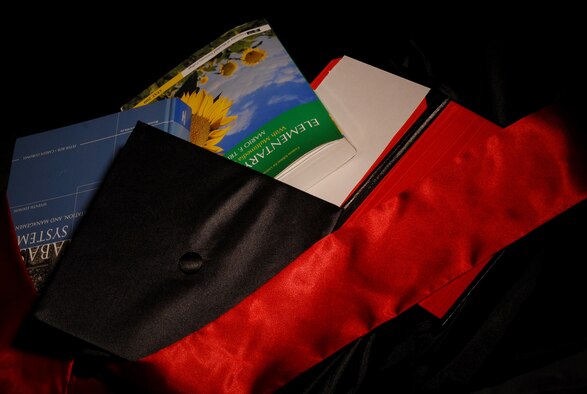 The Air Force provides ample opportunities for its members to attend and complete higher level education through its tuition assistance program. This program covers the cost of college classes, traditional and online, as well as CLEP and DANTES exams at 100 percent for active duty servicemembers. With this program more active duty members graduate receiving their associates, bachelors, and masters degrees in the field of their choice. (U.S Air Force photo by Tech Sgt. Eric T. Sheler) 