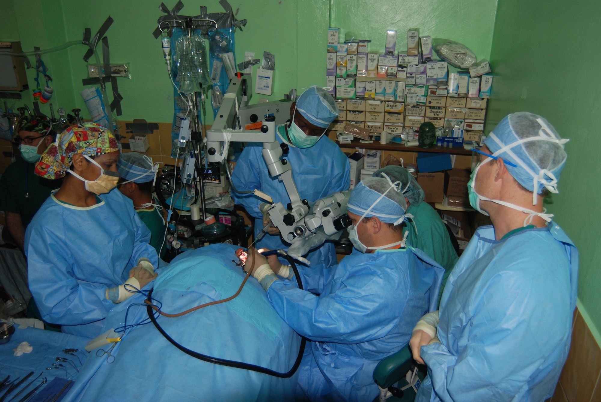 A surgical team from Walter Reed Army Medical Center perfom ear surgery on a Honduran patient at Hospital Leonardo Martinez V. in San Pedro Sula, Honduras. The team was part of a readiness training mission in Honduras May 17-28 and performed surgeries on 55 local Hondurans. (U.S. Air Force photo/Tech. Sgt. John Asselin)