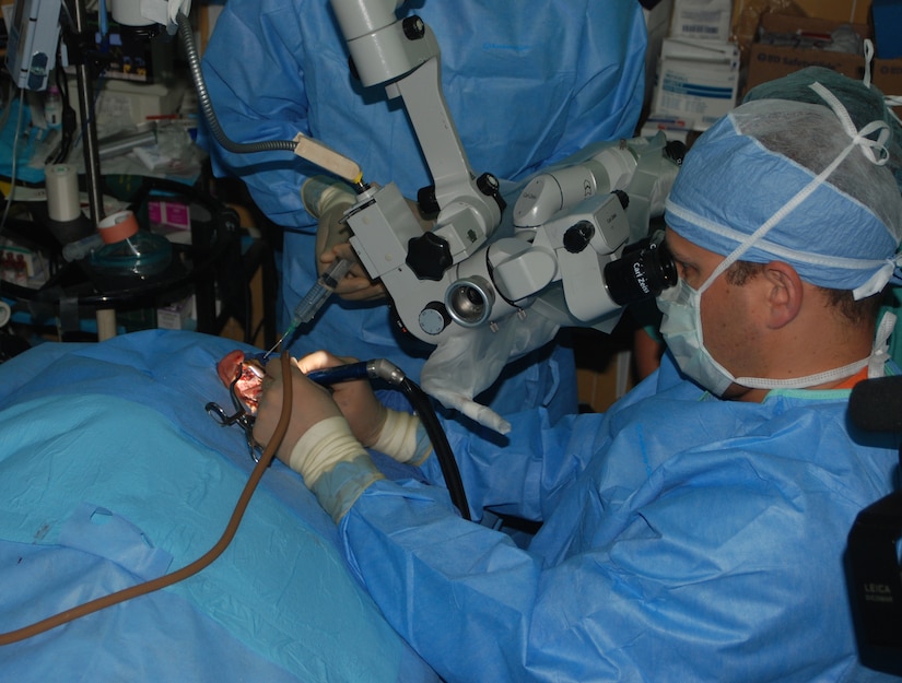 Maj. (Dr.) Scott Howard, an ear, nose and throat surgeon from Walter Reed Army Medical Center in Washington, D.C, performs ear surgery on a Honduran patient in San Pedro Sula, Honduras. A 13-person ENT team from Walter Reed performed screenings, hearing aid fittings and surgeries May 17-28 at Hospital Leonardo Martinez V. (U.S. Air Force photo/Tech. Sgt. John Asselin)