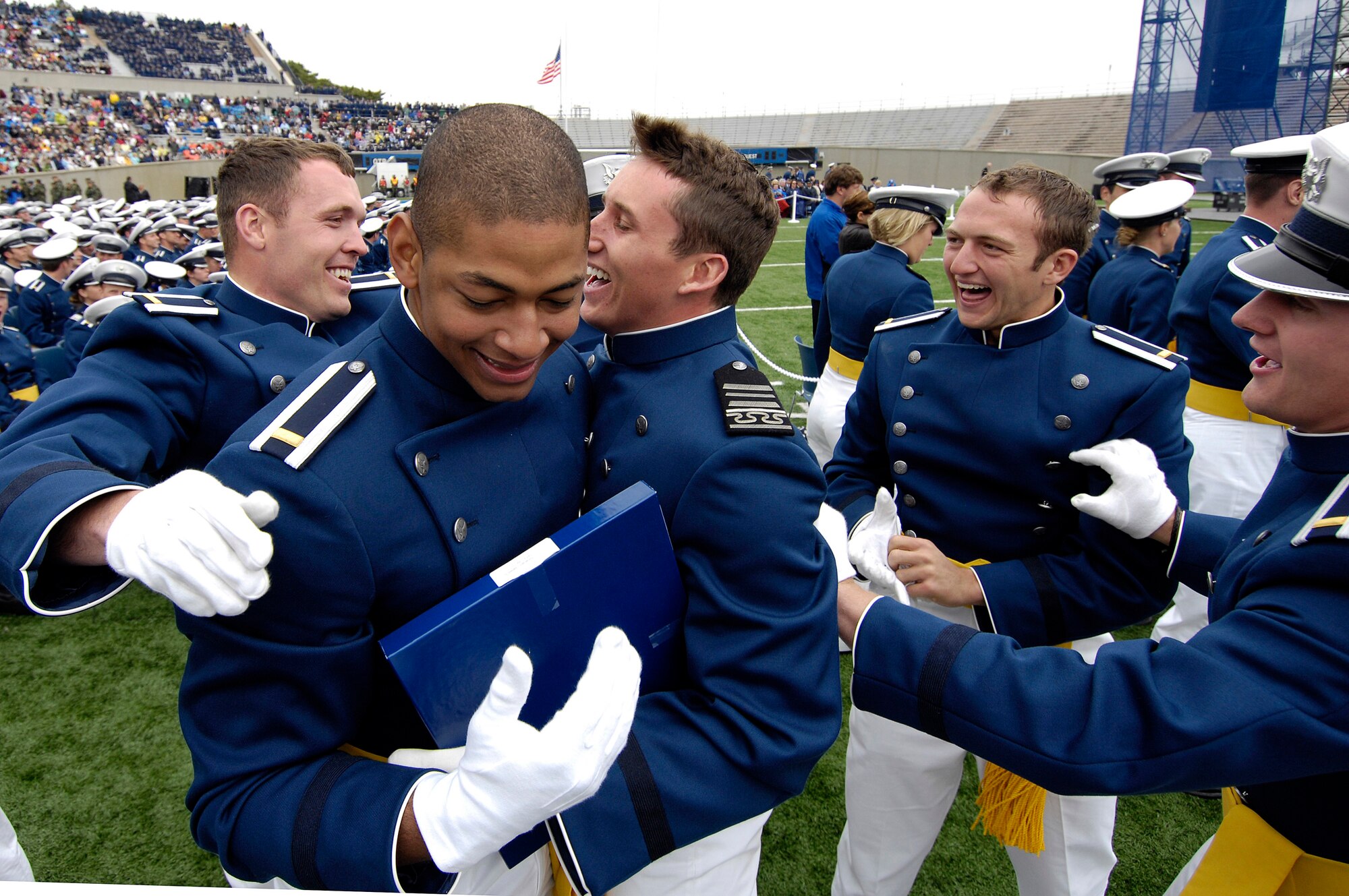 Newly-graduated second lieutenants celebrate after the traditional hat toss and Air Force Thunderbird flyover during the U.S. Air Force Academy Class of 2008 Graduation Ceremony at Falcon Stadium May 28.  The Class of 2008, the 50th Academy class, comprised 1,012 cadets who will enter the Air Force as second lieutenants.  (U.S. Air Force photo/Mike Kaplan)