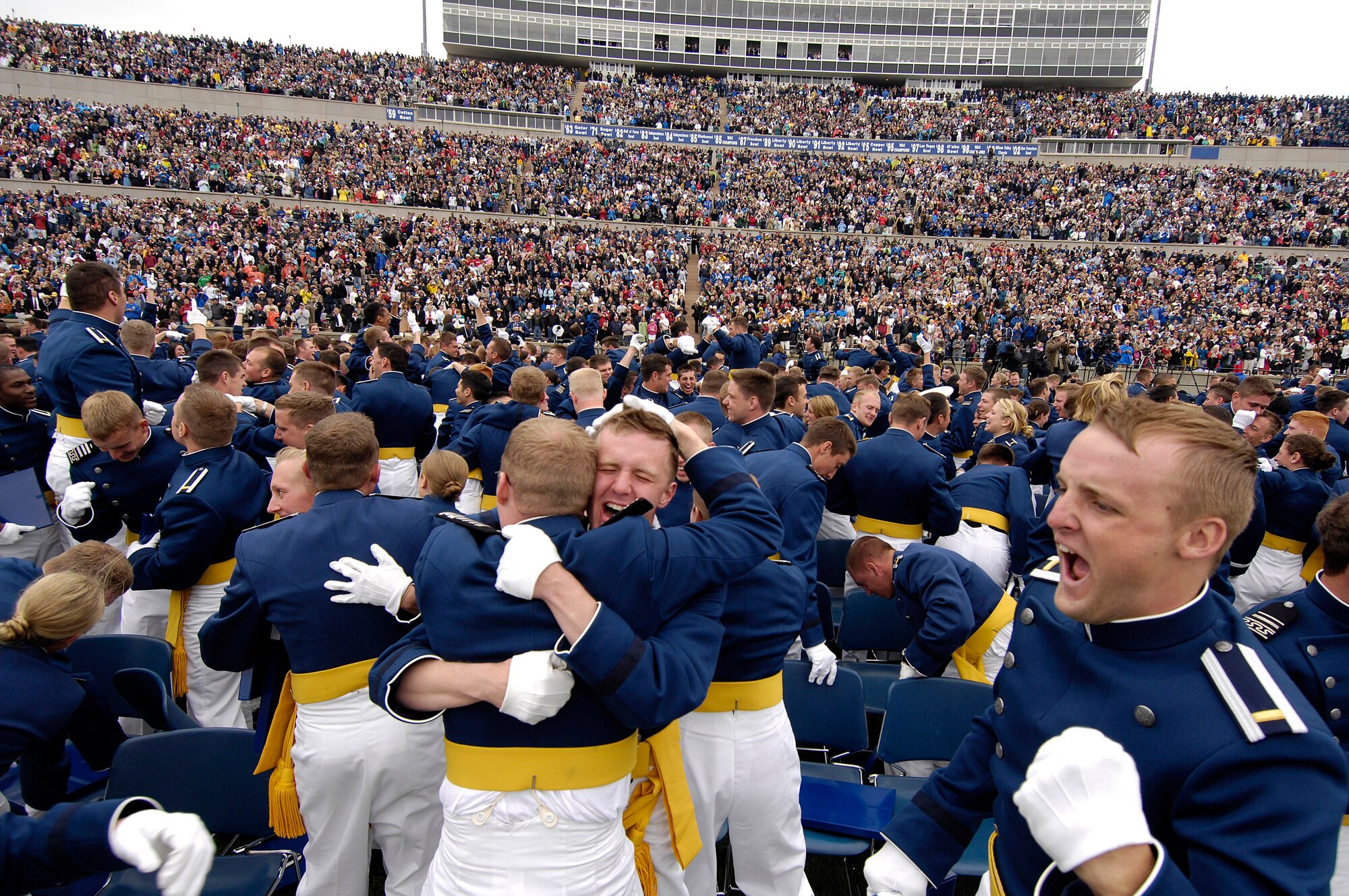 Newly-graduated second lieutenants celebrate after the traditional hat toss and Air Force Thunderbird flyover during the U.S. Air Force Academy Class of 2008 Graduation Ceremony at Falcon Stadium May 28.  The Class of 2008, the 50th Academy class, comprised 1,012 cadets who will enter the Air Force as second lieutenants.  (U.S. Air Force photo/Mike Kaplan)