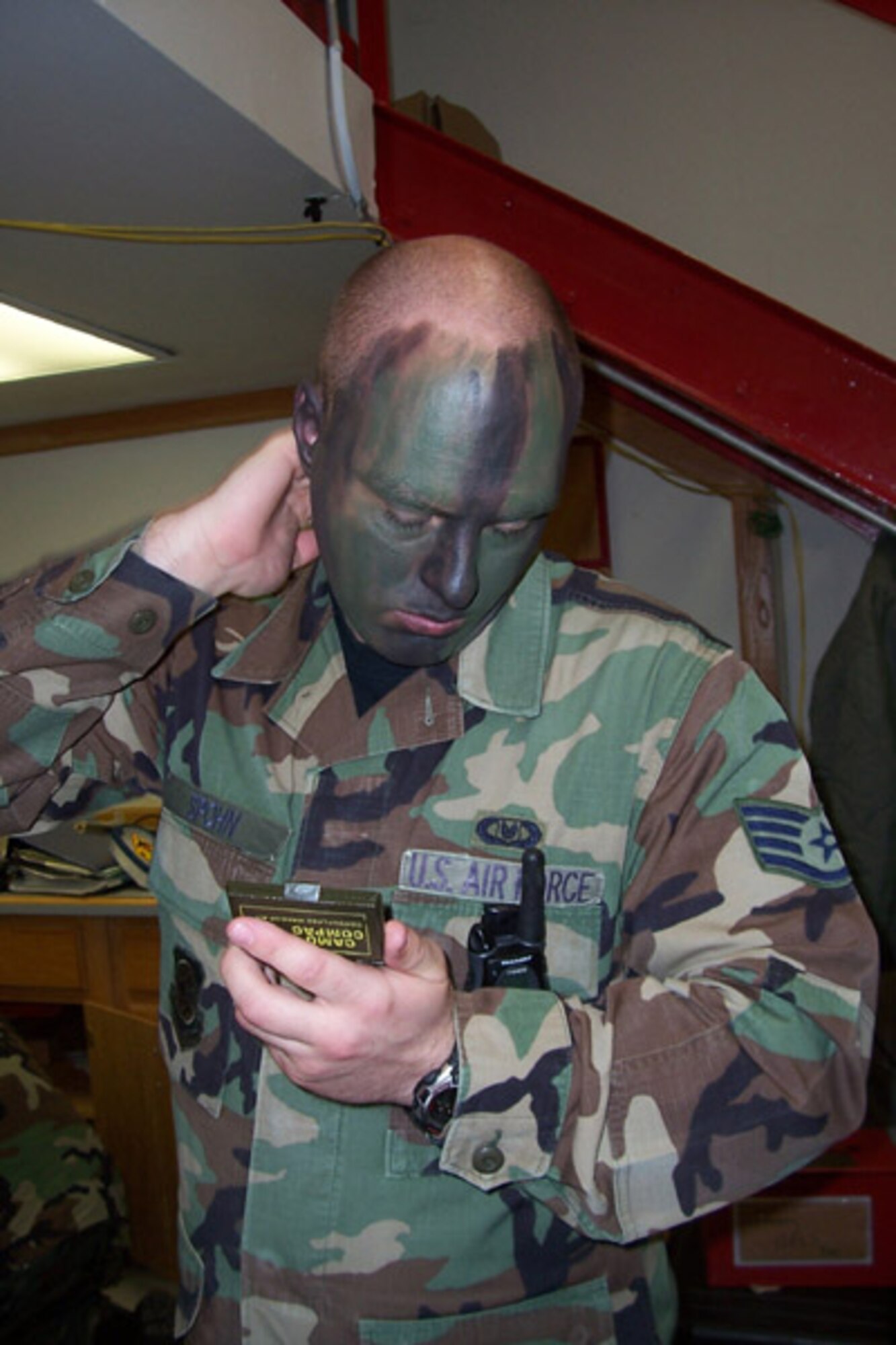 SSgt. John Spohn, an Aircrew Life Support Specialist with the 465th Air Refueling Squadron, demonstrates techniques for applying camoflague make up during an aircrew survival training course held recently.