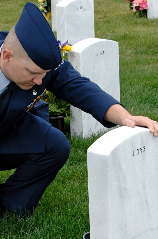 Staff Sgt. Jody Haslip, 28th Medical Group lab technician, pays respects to his father at the Black Hills National Cemetery, S.D., May 25. Sergeant Haslip's father served in the Vietnam War and passed away in 2006. (U.S. Air Force photo/Airman Matthew Flynn)