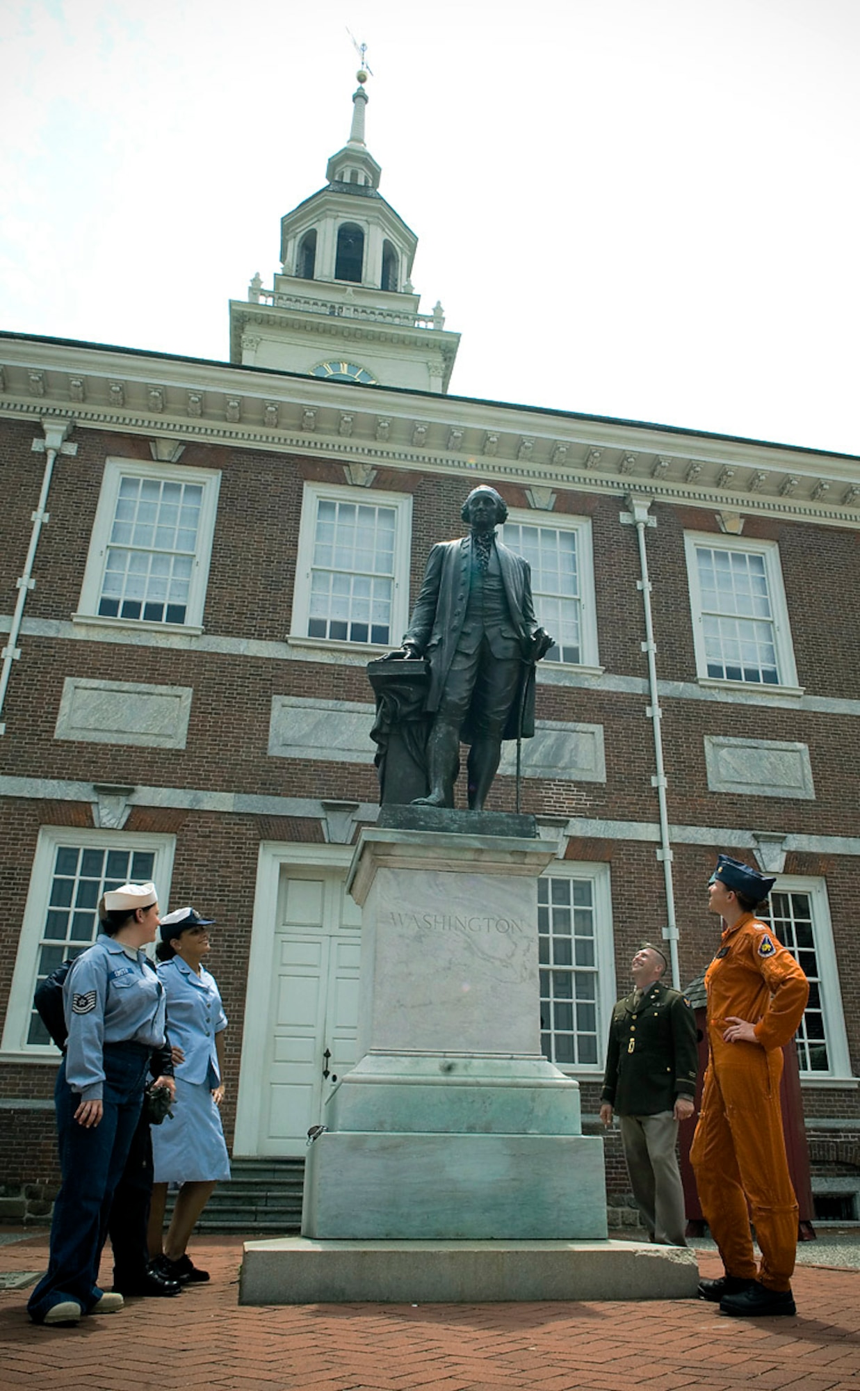 Parade of Uniform members, wearing various vintage Air Force uniforms; take a closer look at the George Washington monument in front of Independence Hall during Air Force Day at Independence Hall in Philadelphia, May 27, in conjunction with Air Force Week - Philadelphia. The Parade of Uniforms exhibit is the largest private collection of vintage Air Force uniforms owned and showcased by Tech. Sgt. Jack Waide stationed at Elmendorf Air Force Base, Alaska. The week is designed to broaden awareness of the U.S. Air Force's role in the war on terrorism and strengthen support for Airmen serving worldwide in defense of freedom. (U.S. Air Force photo/Staff Sgt. Bennie J. Davis III)
