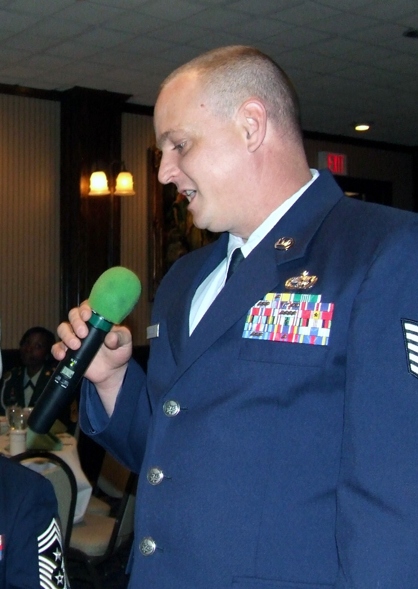 Tech. Sgt. Scott Mueller, from the U.S. Air Force Expeditionary Center's 421st Combat Training Squadron on Fort Dix, N.J., introduces himself to the Mount Holly, N.J., Rotary Club during a luncheon by the Rotary Club May 28, 2008, in Mount Holly.  Airmen from the USAF EC and Soldiers from Fort Dix were guests of honor as part of the Club's annual observance honoring the military.  (U.S. Air Force Photo/Tech. Sgt. Scott T. Sturkol)