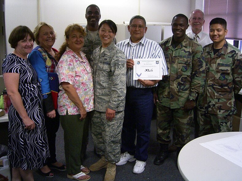 LAUGHLIN AIR FORCE BASE, Texas – Tino Gomez, GeoBase Program Manager with the 47th Installation Support Squadron, poses with his XLer award along side fellow 47th ISS members. (U.S. Air Force photo by Col. John Doucette)