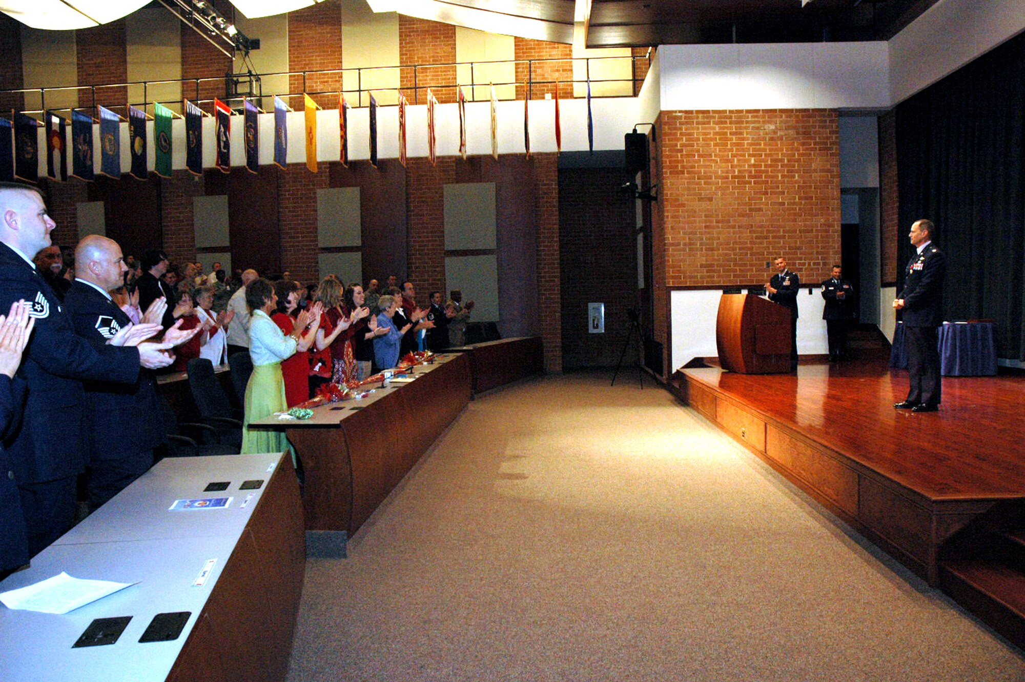 Col. Chuck Stiles, U.S. Air Force Expeditionary Center vice commander, receives a standing ovation in honor of his 30 years of service at the end of his retirement ceremony May 22, 2008, in the USAF EC's Grace Peterson Hall on Fort Dix, N.J.  (U.S. Air Force Photo/Tech. Sgt. Scott T. Sturkol)