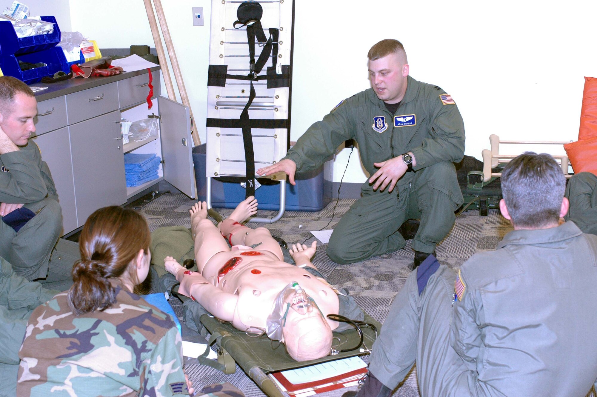 Capt. Adam Hohman, 934th Aeromedical Evacuation Squadron flight nurse, trains aeromeds on using a chest tube drain.  The training is part of Readiness Skills Verification Training which is completed annually by the AES. Photo by Staff Sgt. Michael Edmond.