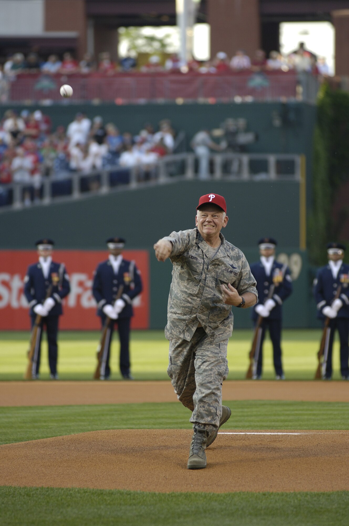General Arthur Lichte, Air Mobility Command commander, throws the first pitch at the Phillies game in Citizens Bank Park as part of Air Force Week in Philadelphia. (U.S. Air Force photo/Kenn Mann)