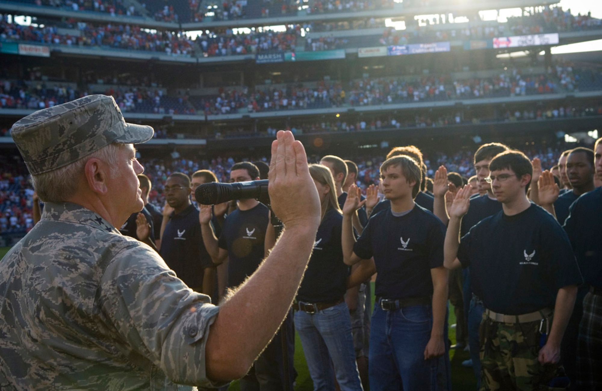 Gen. Arthur J. Lichte, commander of Air Mobility Command, enlists 170 new recruits into the U.S. Air Force during pre-game activities at the Philadelphia Phillies - Colorado Rockies game May 26.  Activities at the game were held in conjunction with Air Force Week-Philadelphia.  The week is designed to broaden awareness of the U.S. Air Force's role in the war on terrorism and strengthen support for Airmen serving worldwide in defense of freedom.  (U.S. Air Force photo/Staff Sgt. Bennie J. Davis III)