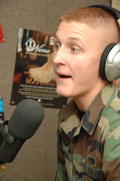 Senior Airman Jacob Johnson, 49th Maintenance Squadron, discusses his job during a tour at local radio station May 20 in Alamogordo, N.M. Airman Johnson had the opportunity to be on live air during a 94 Key KYEE FM 94.3 interview with James "Double J" White, Burt Broadcasting operations manager and 94 Key DJ. (U.S. Air Force photo/Airman 1st Class Jamal D. Sutter)