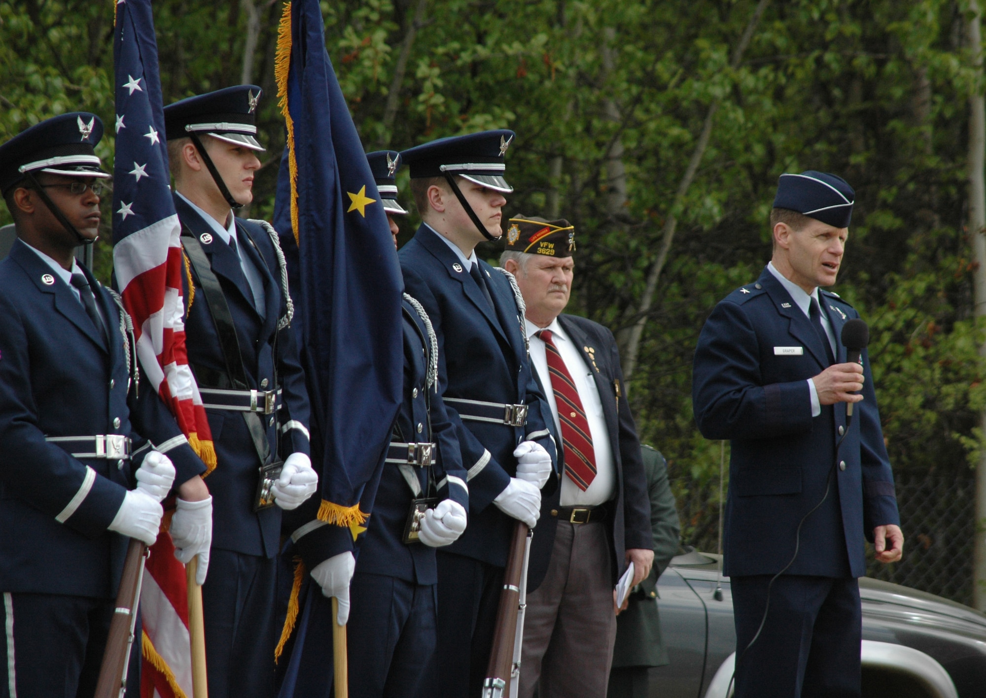 Brig. Gen. Mark Graper, 354th Fighter Wing commander, speaks about the importance of Memorial Day at Birch Hill Cemetery in Fairbanks May 26 as the Eielson Air Force Base Honor Guard serves as the color guard at the event. Every year posts from the American Legion and Veterans of Foreign Wars organize a series of Memorial Day services at various locations in honor of America?s fallen heroes. (U.S. Air Force photo/Staff Sgt. Shad Eidson)