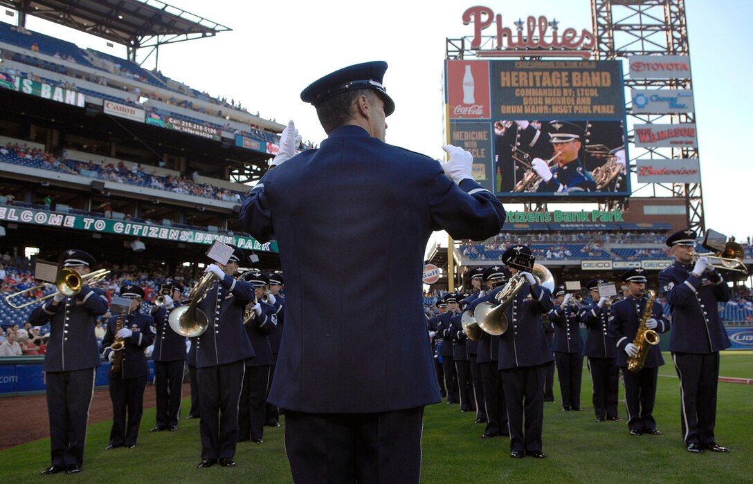The U.S. Air Force Heritage of America Band plays the Air Force song during pre-game activities at the Philadelphia Phillies - Colorado Rockies game May 26.  Activities at the game were held in conjunction with Air Force Week-Philadelphia.  The week is designed to broaden awareness of the U.S. Air Force's role in the war on terrorism and strengthen support for Airmen serving worldwide in defense of freedom.  (U.S. Air Force photo/Staff Sgt. Bennie J. Davis III)