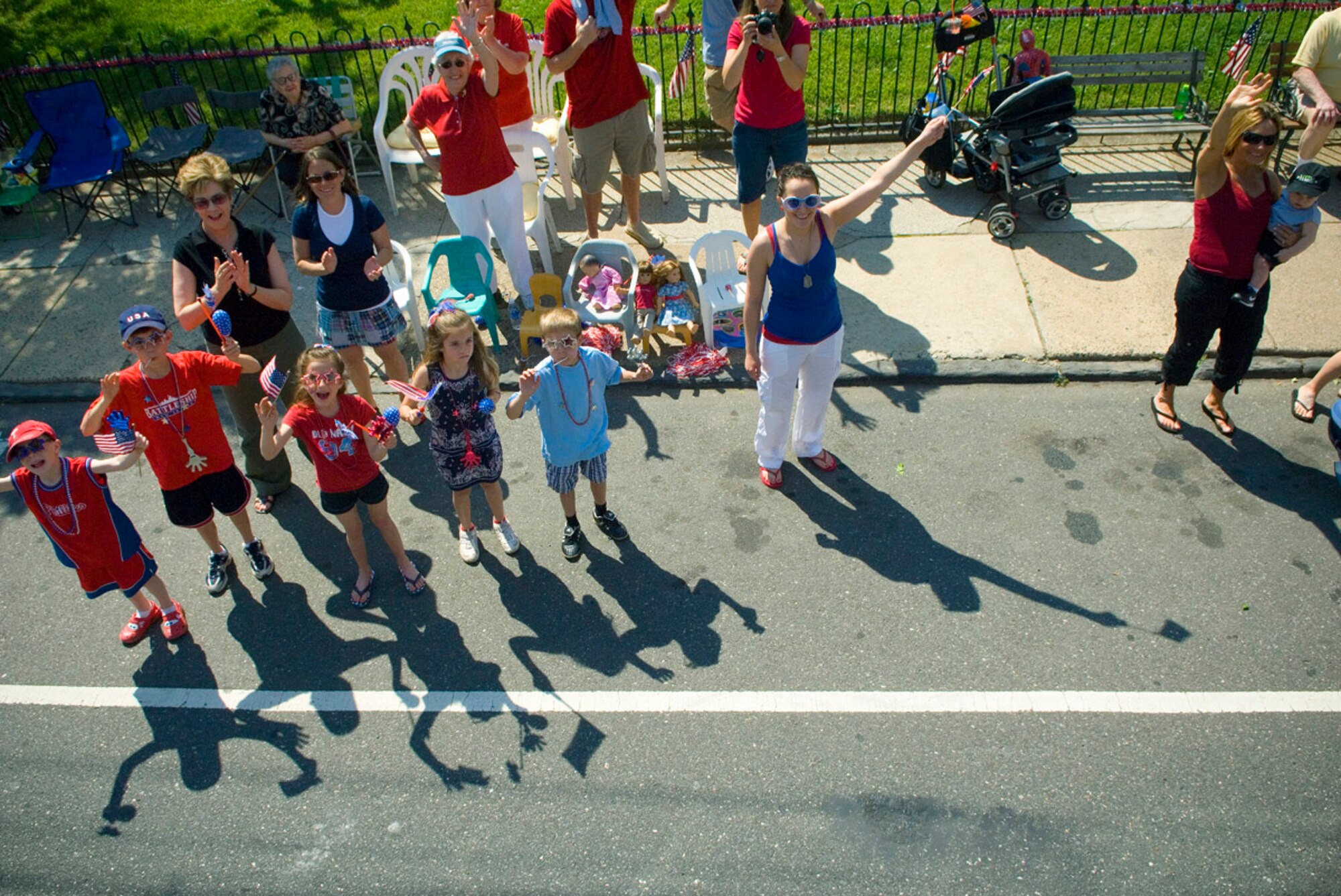 Residents of Bridesburg, Pa., cheer and take pictures of Airmen participating in the Bridesburg Memorial Day Parade May 26. Bridesburg is a borough in Philadelphia and hosted the kickoff celebrations for Air Force Week Philadelphia. Air Force Week Philadelphia is an event designed to build new relationships in the Philadelphia metropolitan area and strengthen public support for the Air Force mission and Airmen serving worldwide in the war on terrorism. (U.S. Air Force photo/Staff Sgt. Bennie J. Davis III)