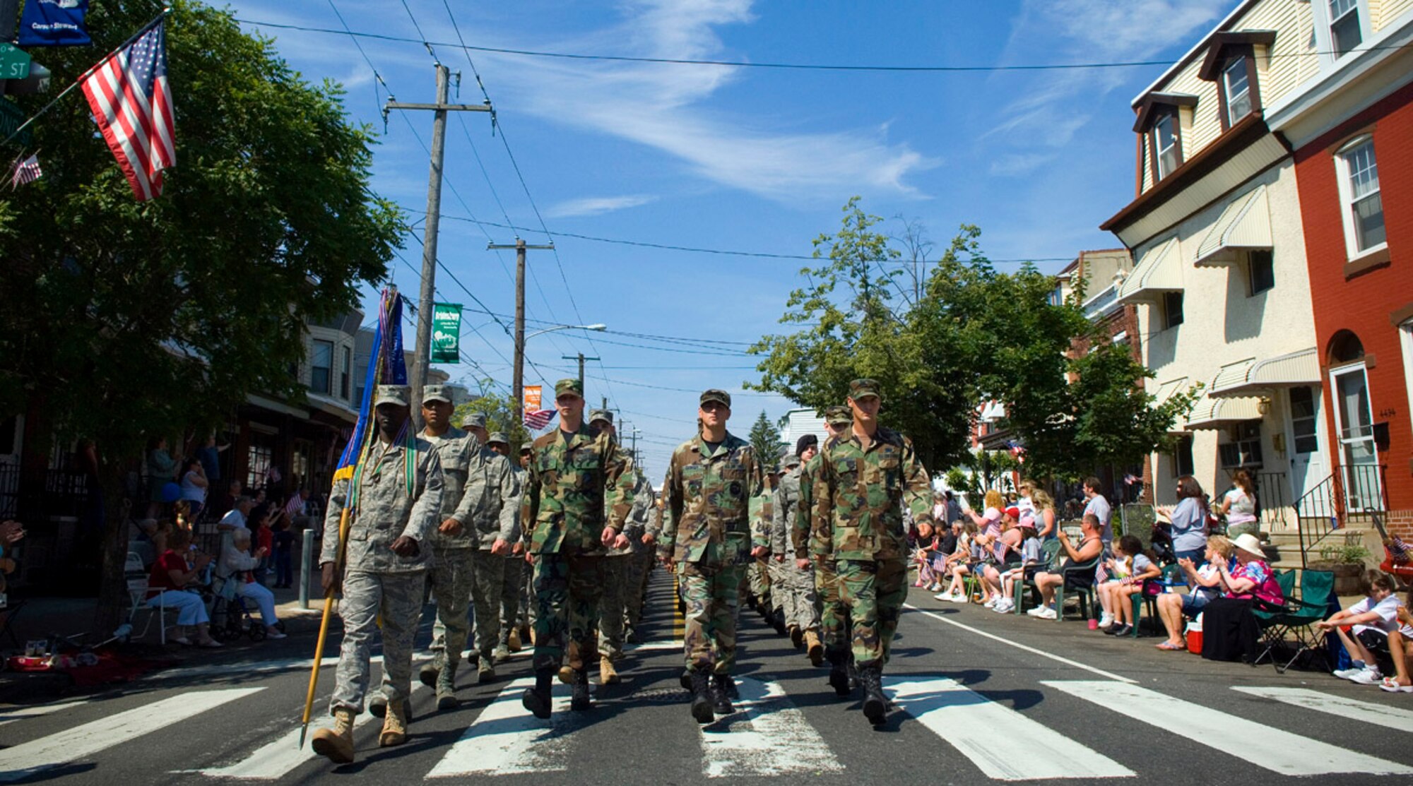 305th Air Mobility Wing Airmen from McGuire Air Force Base, N.J., march during the Bridesburg Memorial Day Parade May 26. Bridesburg is a borough in Philadelphia and hosted the kickoff celebrations for Air Force Week Philadelphia. The parade featured a fly-by of a KC-135 Stratotanker and a KC-10 Extender and a performance by the U.S. Air Force Heritage of America Band. Air Force Week Philadelphia is an event designed to build new relationships in the Philadelphia metropolitan area and strengthen public support for the Air Force mission and Airmen serving worldwide in the war on terrorism. (U.S. Air Force photo/Staff Sgt. Bennie J. Davis III)