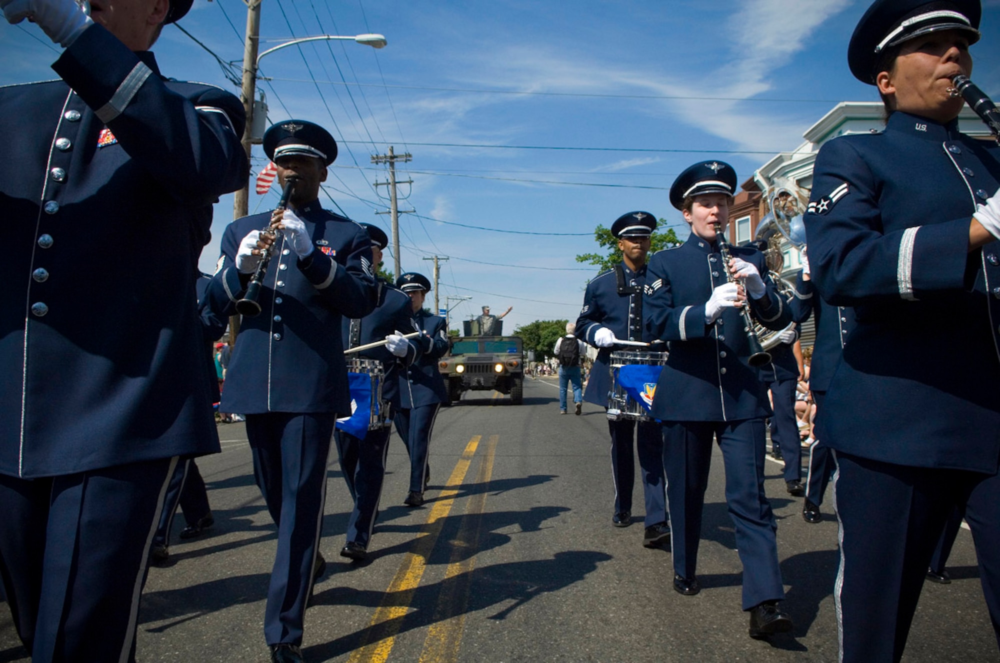 Airmen from the U.S. Air Force Heritage of America Band play the "The U.S. Air Force" song while marching in the Bridesburg Memorial Day Parade May 26. Bridesburg is a borough in Philadelphia and hosted the kickoff celebrations for Air Force Week Philadelphia. The parade featured a fly-by of a KC-135 Stratotanker and a KC-10 Extender and a performance by the U.S. Air Force Heritage of America Band. Air Force Week Philadelphia is an event designed to build new relationships in the Philadelphia metropolitan area and strengthen public support for the Air Force mission and Airmen serving worldwide in the war on terrorism. (U.S. Air Force photo/Staff Sgt. Bennie J. Davis III)