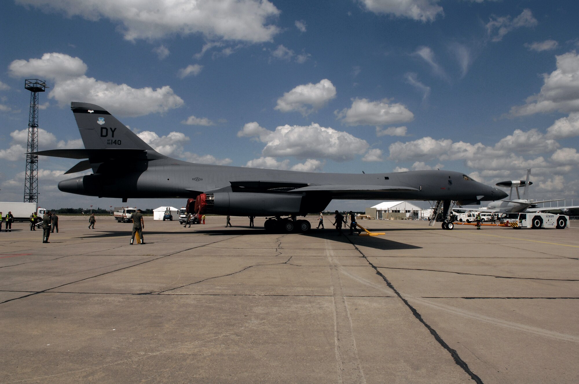 Schoenefeld Airport contractors tow a B-1B Lancer bomber aircraft into place in preparation of the 2008 Berlin Airshow here May 24. The B-1B, its aircrew and maintenence personnel are based with the 7th Bomb Wing at Dyess Air Force Base, Texas. (U.S. Air Force photo/Tech. Sgt. Corey Clements) 