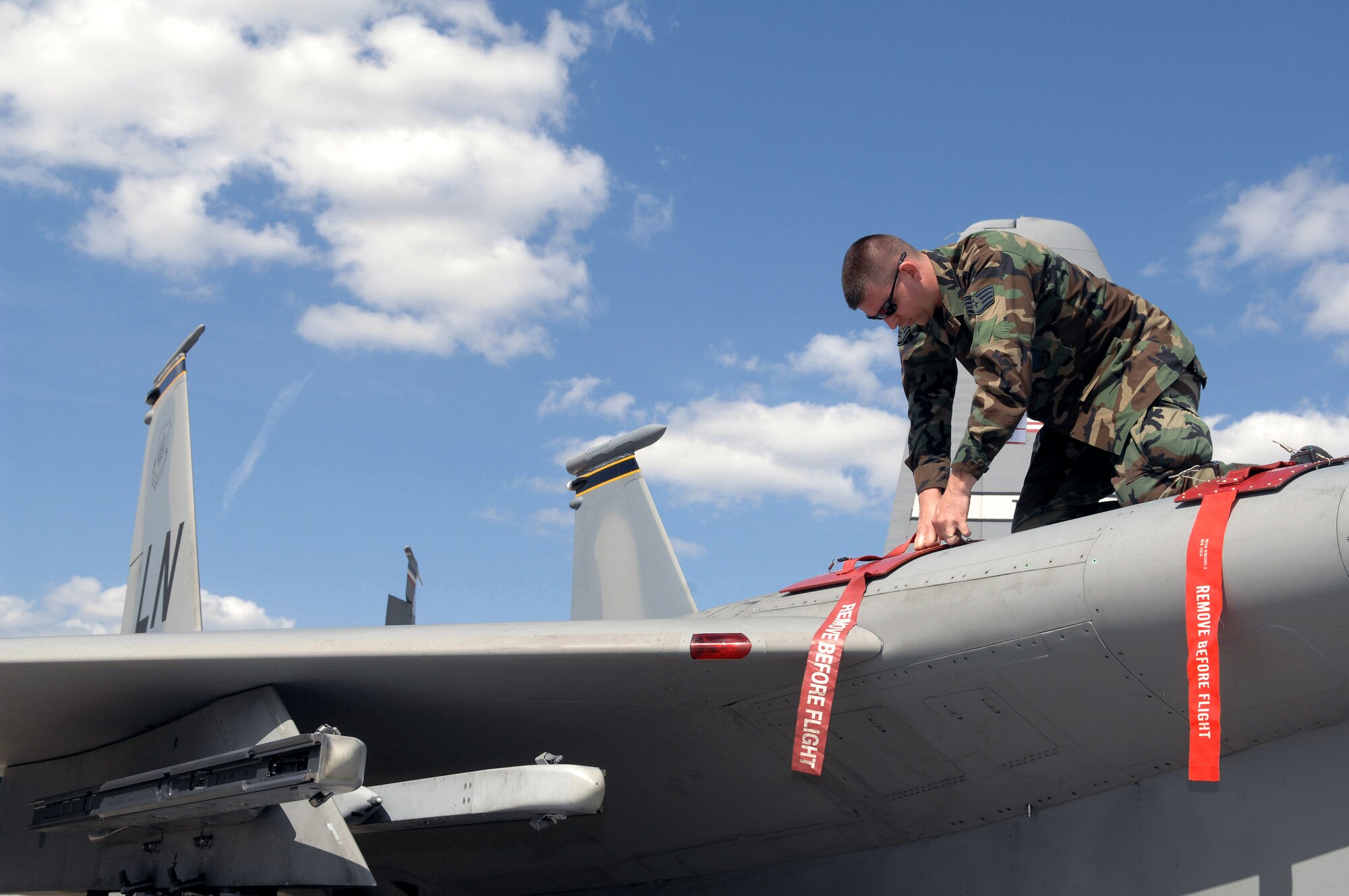 Staff Sgt. Russell Middleton installs the covers for gunloaders on an F-15 Eagle from the 48th Fighter Wing, Royal Air Force Lakenheath, U.K., here May 25 in preparation for the 2008 Berlin Airshow. U.S. participation in the Berlin Airshow enhances the U.S.-German military-to-military relationship and supports security cooperation strategic direction efforts. Sergeant Middleton is an aircraft electrical and environmental systems technician from the 493rd Fighter Squadron at Lakenheath, U.K. (U.S. Air Force photo/Tech. Sgt. Corey Clements)