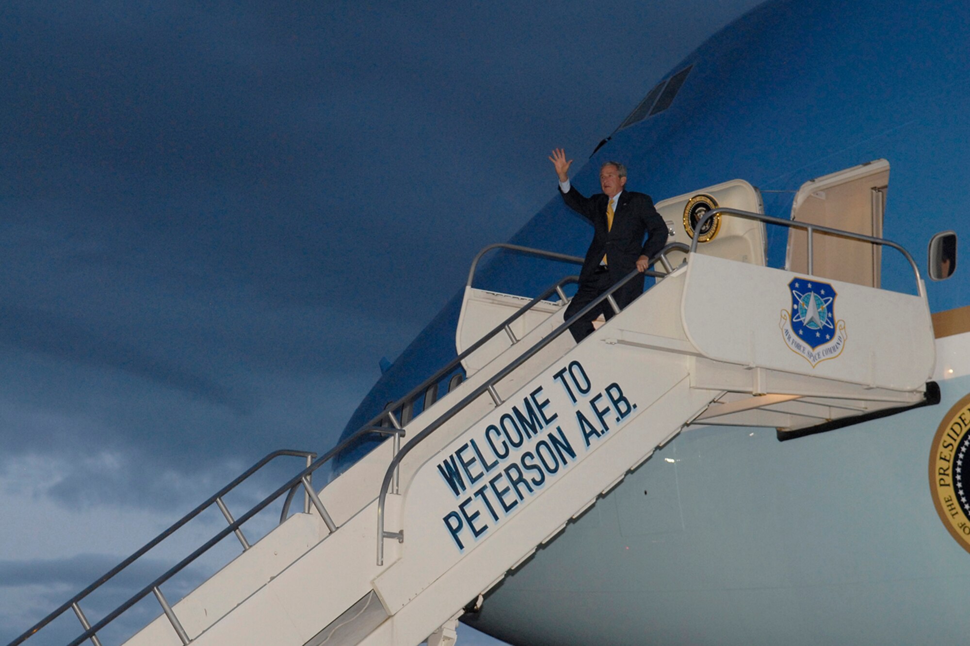 President George W. Bush waves to onlookers as he exits Air Force One at Peterson Air Force Base May 27. The president came to Colorado Springs to speak at the 50th Air Force Academy Graduation May 28. (U.S. Air Force photo by Mr. Rob Bussard)