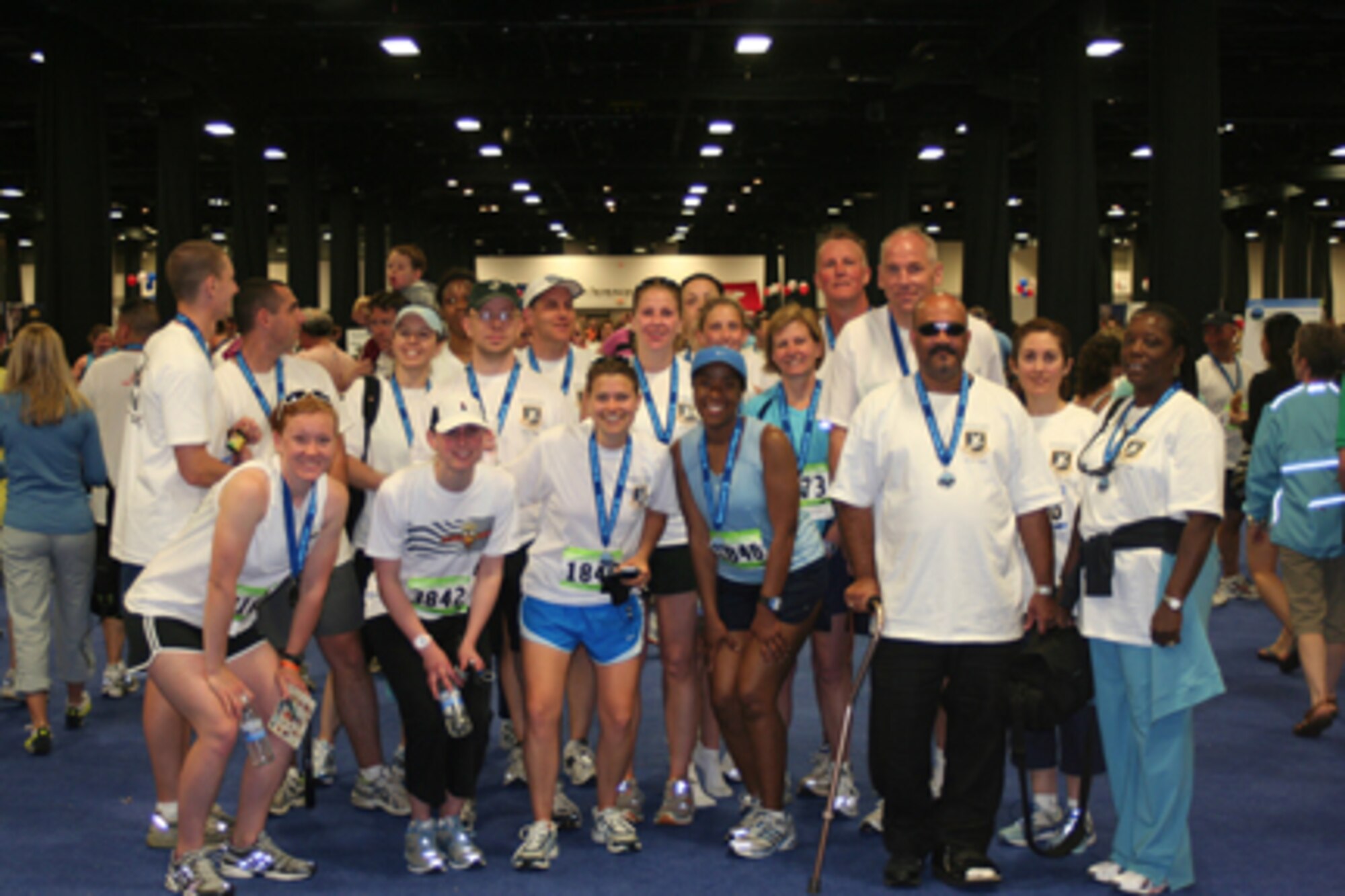 HANSCOM AFB, Mass. – Runners from Hanscom pose with the parents, Michael and Jackie Chavis (front row far right), of fallen Security Forces Airman First Class LeeBernard Chavis,  after completion of the Run to Remember race in Boston May 25. Hanscom personnel took part in both the 5K race and half marathon in memory of fallen Security Forces Airmen. The Chavis family flew in from Reston, Virginia to attend the race in honor of their son, who was a Security Forces member killed in action in 2006. The race is held annually to recognize the men and women in law enforcement killed in the line of duty. (U.S. Air Force photo by Maj. Tamara Mayer)