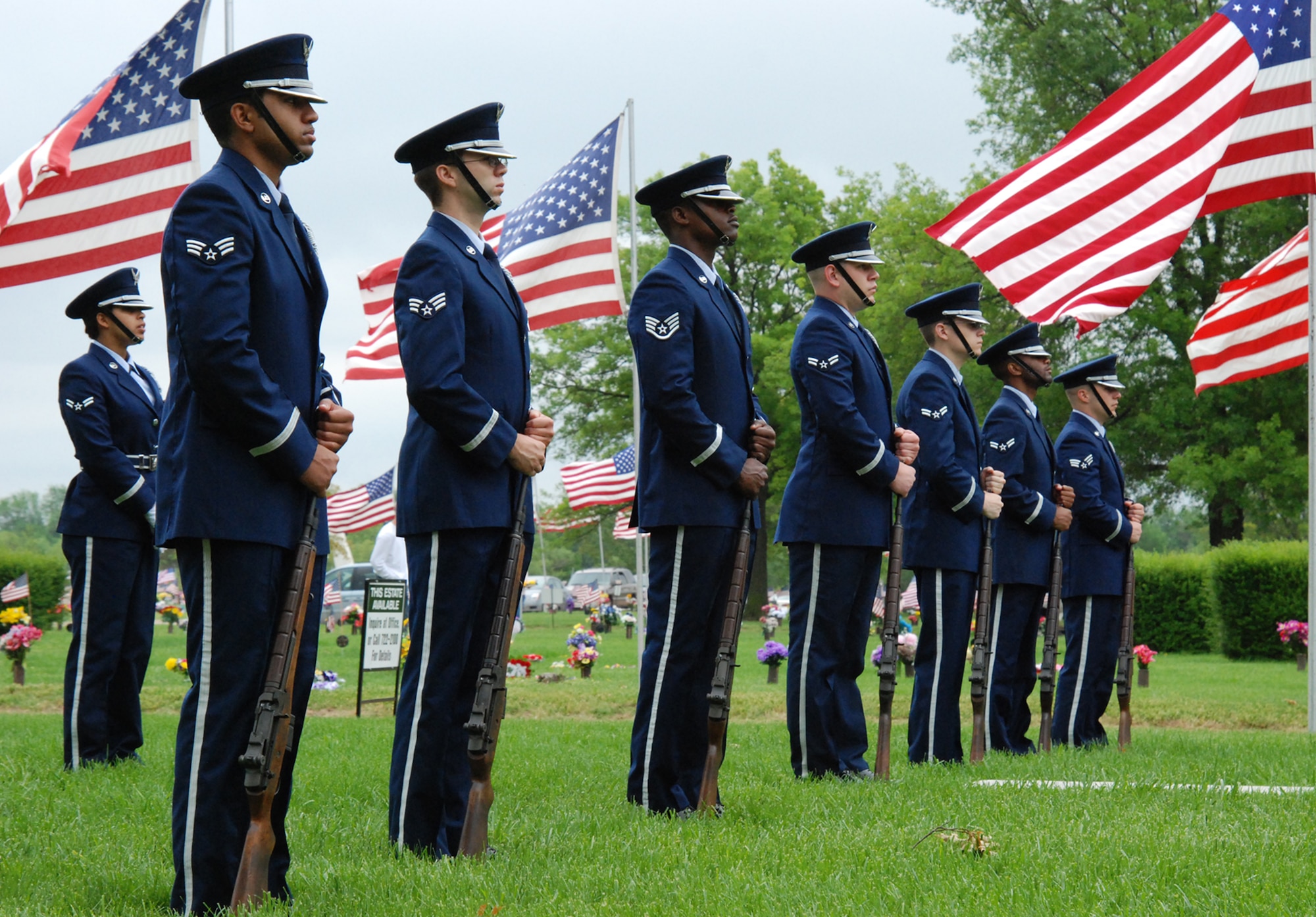 Wichita, Kan. -- McConnell Air Force Base Honor Guard members stand at ease during a ceremony at the 50th annual Memorial Day observance at Resthaven mortuary and cemetery in Wichita, May 26. Honor Guard members posted colors and performed a seven-gun, three volley salute during the ceremony to honor the fallen men and women of the U.S. Military. (Photo by Airman 1st Class Jessica Lockoski)